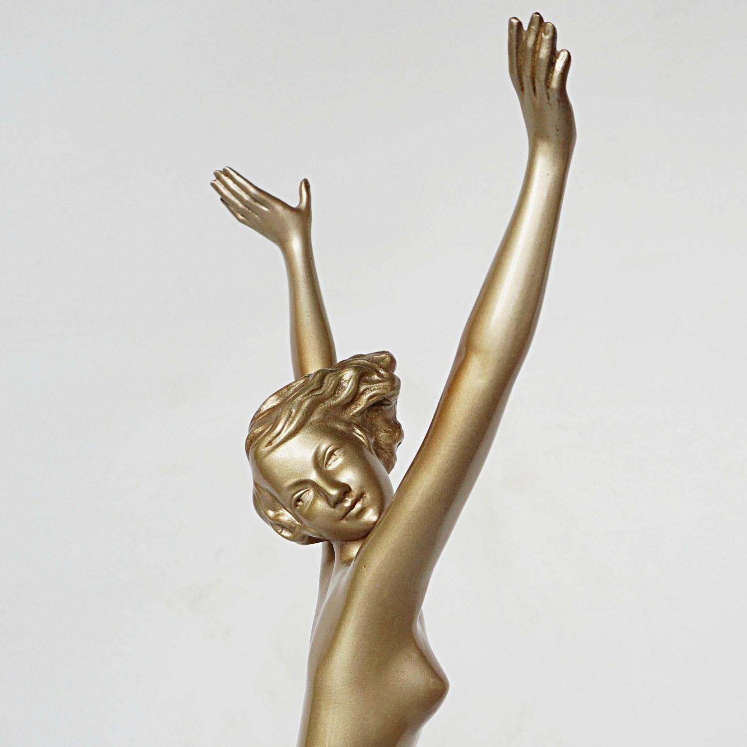 An Art Deco cold painted bronze figure of a dancing nude female with outstretched arms by Josef Lorenzl. Set over a stepped marble plinth. Signed 'Lorenzl' to bronze. 

Josef Lorenzl, born 1stSeptember 1892 began his career at a foundry in the