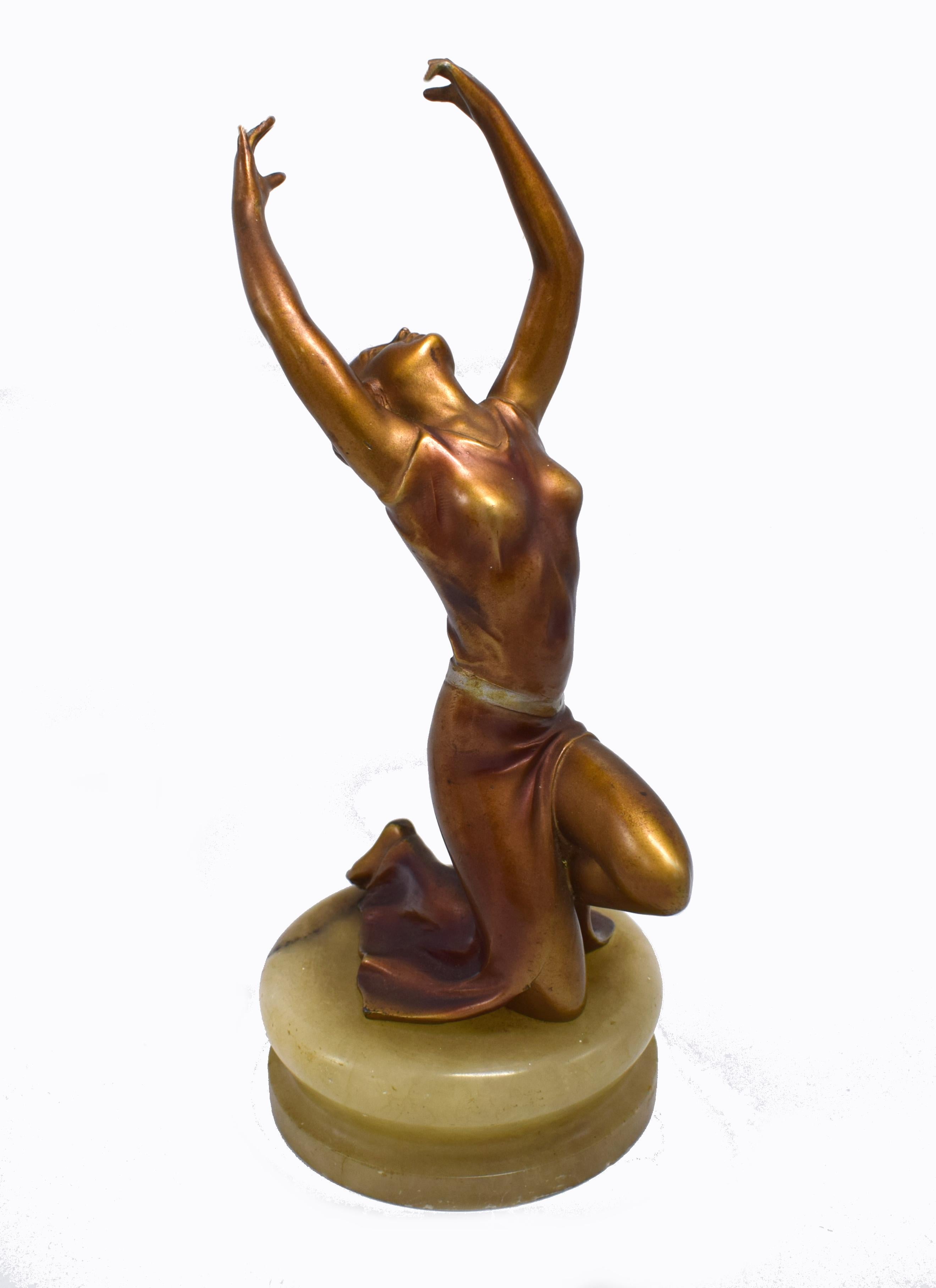 Delightful and totally authentic 1930s Art Deco cold painted spelter female figure resting on a solid Onyx base. Very well executed with fabulous detailing and colours. Quite weighty piece and of good quality, sourced in Europe. The condition is
