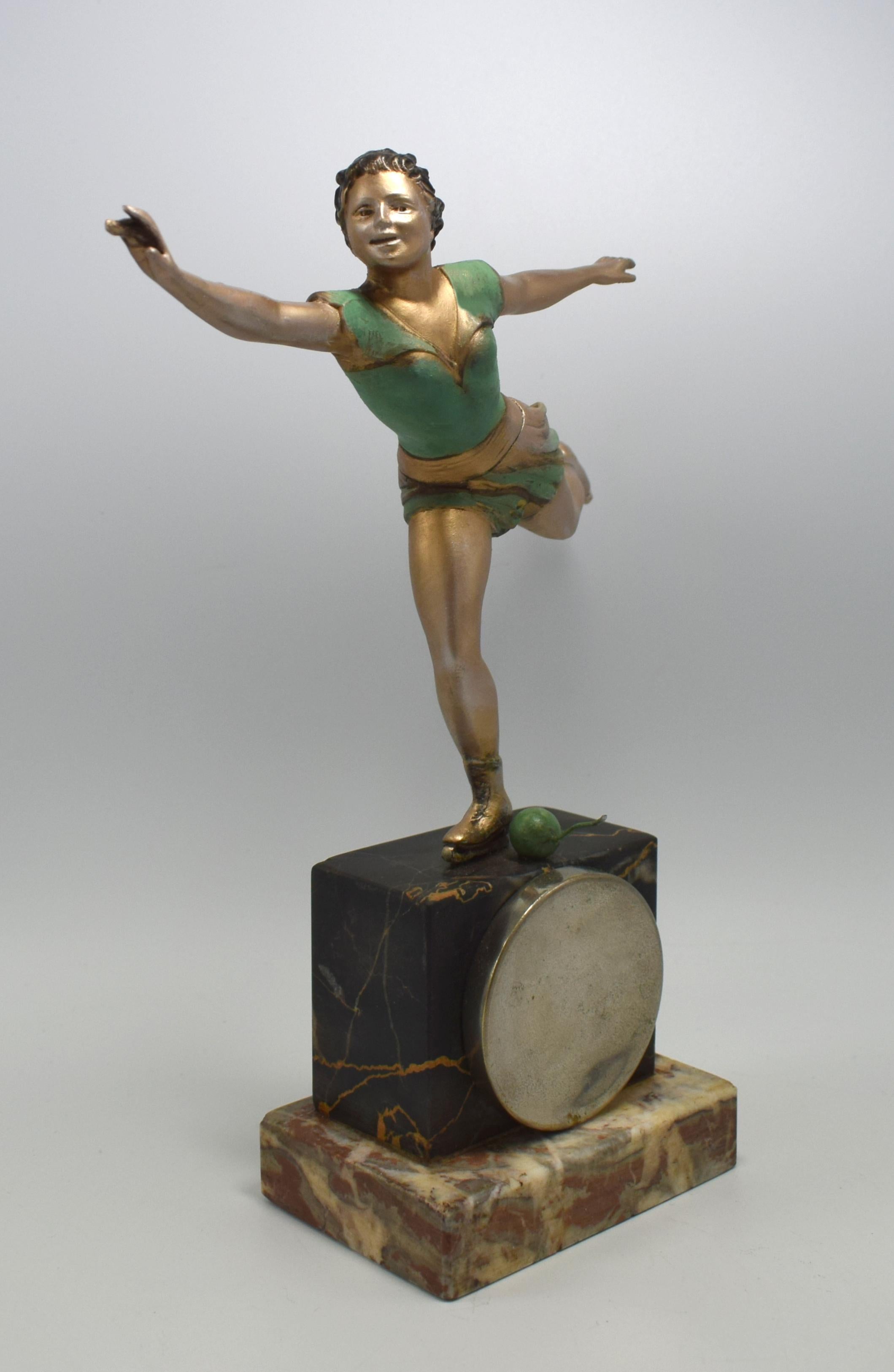 Not often found is this 1930s Art Deco cold painted spelter female skater figure which doubles as a pocket watch stand. The watch suspends from a little wire which protrudes slightly from a ball near her foot. Very well executed with fabulous