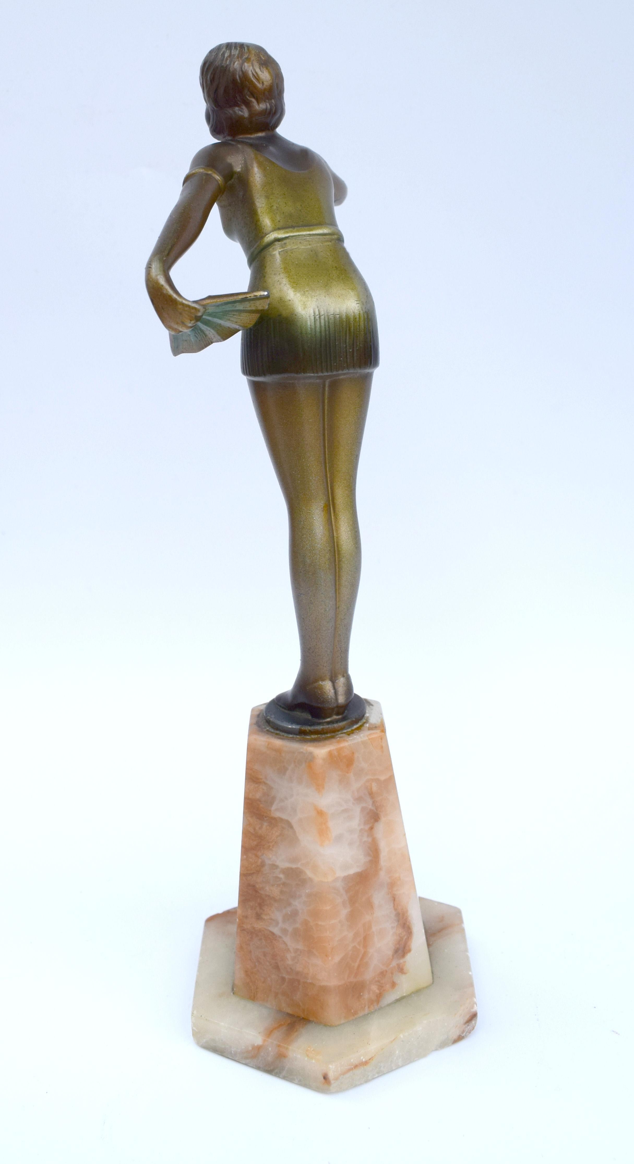 This very stylish example of a 1930s Art Deco figurine in very good condition showing only nominal wear commensurate with age. She's about nine and a half inches tall so a good height to display and depicts a young slender female with her hand