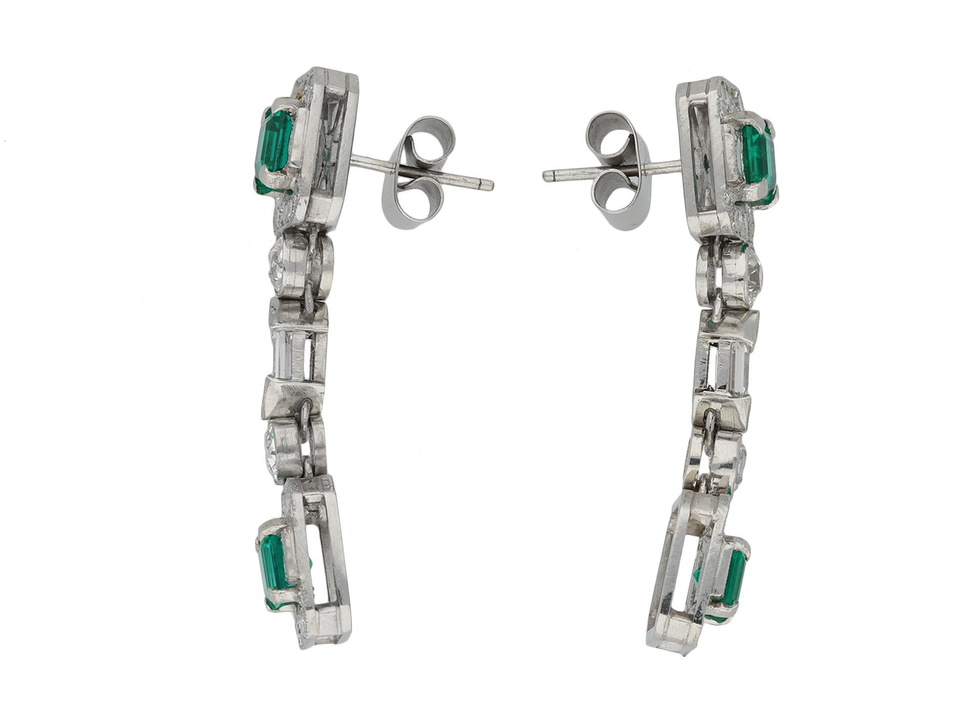 Art Deco Colombian emerald and diamond drop earrings. A matching pair, set to top and bottom with an octagonal emerald-cut natural Colombian emerald with no colour enhancement and minor clarity enhancement in open back claw settings, four in total