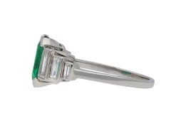 Art Deco Colombian emerald and diamond flanked solitaire ring, circa 1925.