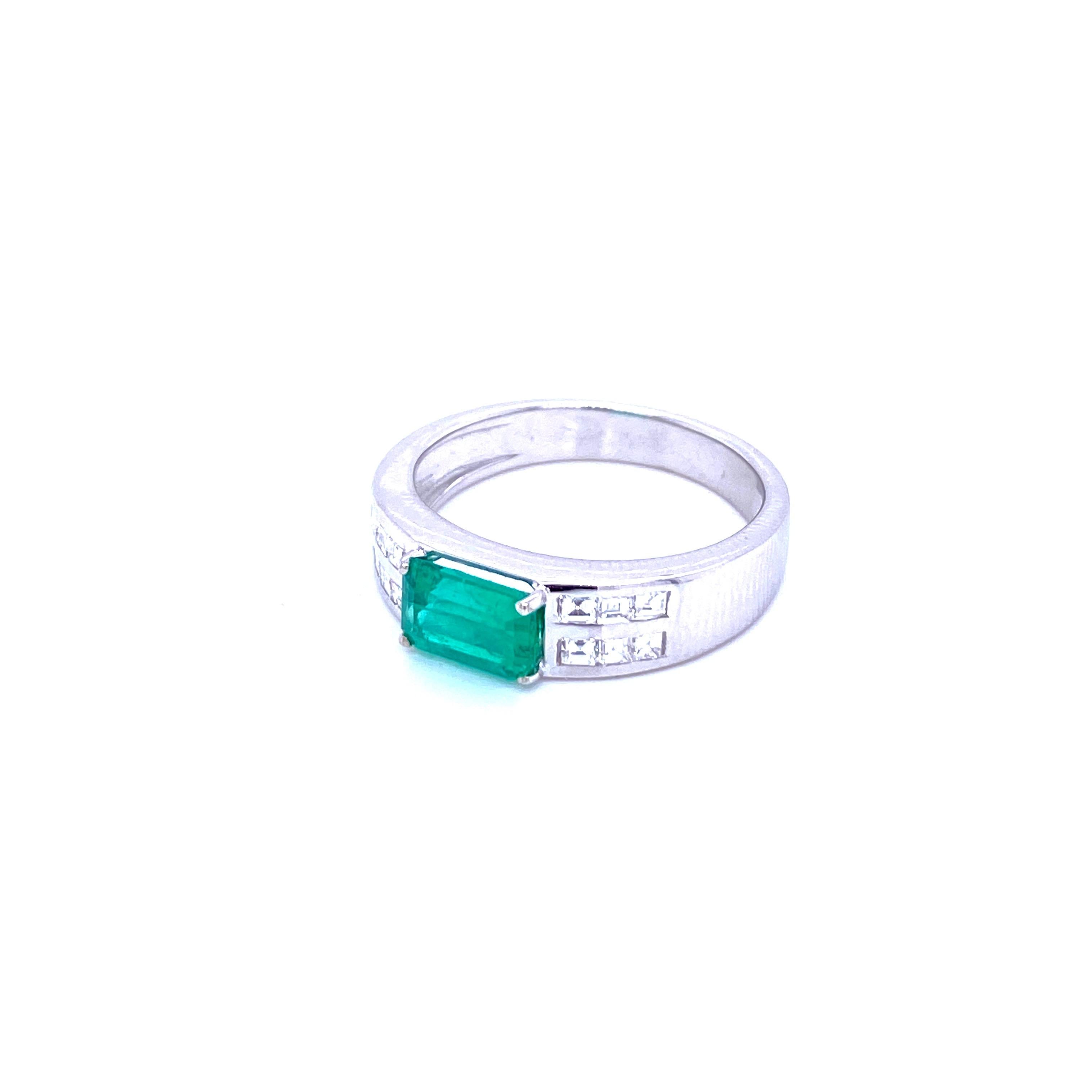 Unusual Art Deco style ring set in 18k white Gold featuring a 1.00 ct Emerald-cut Emerald origin Colombia. Flanked on each side are baguette cut diamonds totaling 0.50 carats G/H color VVS clarity. Circa 1980

CONDITION: Pre-owned - Excellent
