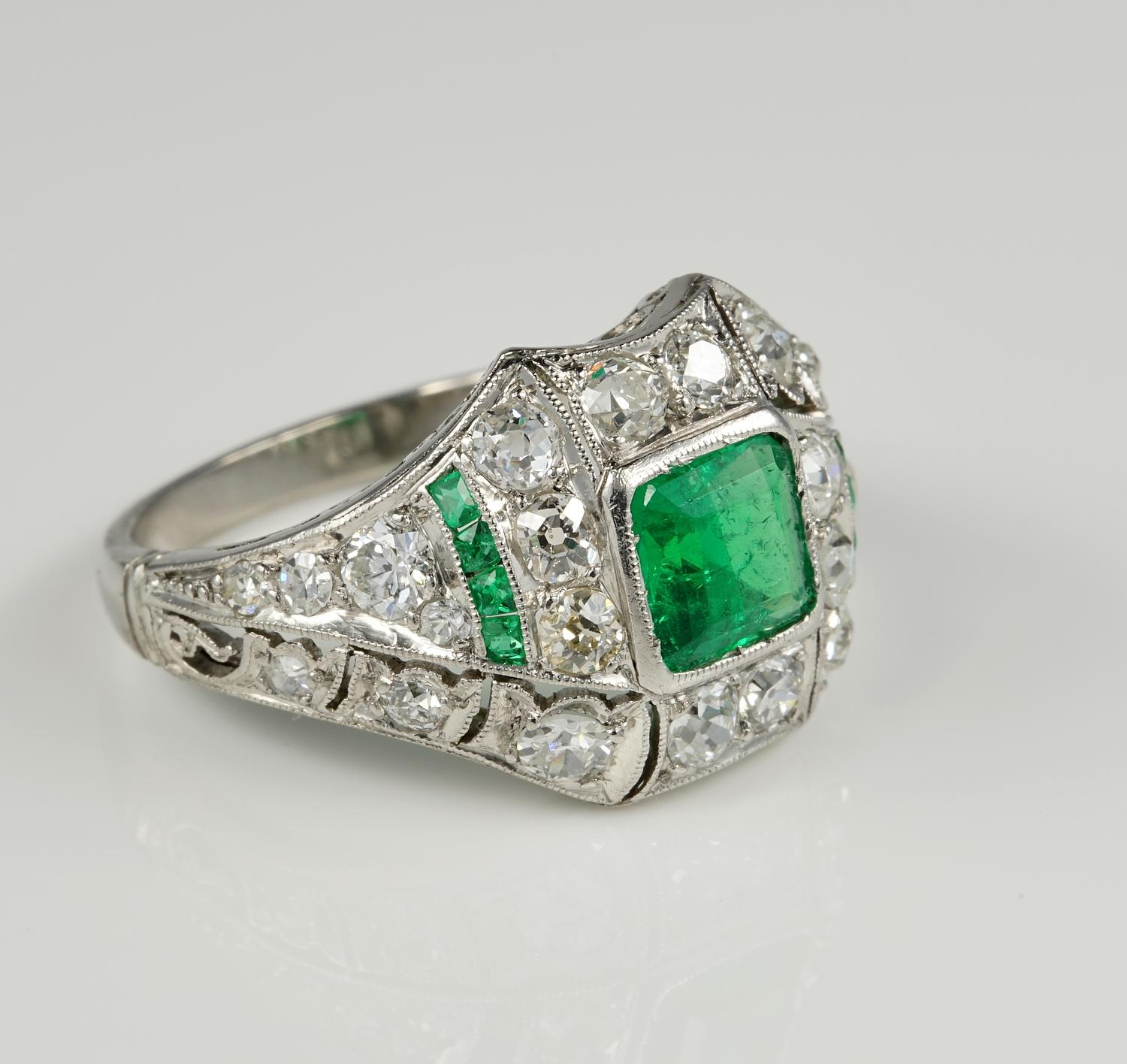 Distinctive and stunning purest Art Deco Colombian Emerald and Diamond ring.
With an intricately designed mounting all of solid Platinum boasting magnificent workmanship of the Deco era.
A Play of geometric lines between gemstones makes this ring
