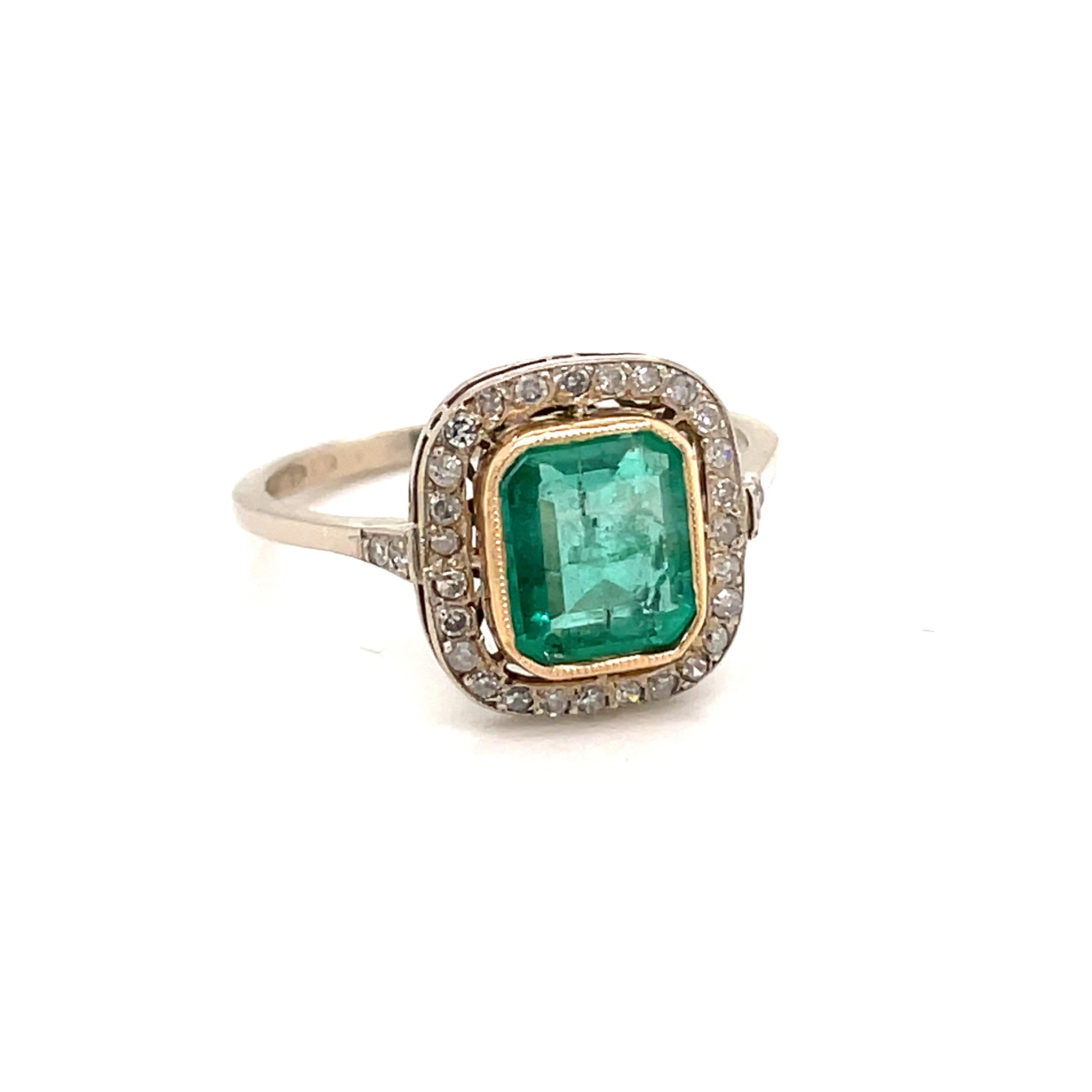 Art Deco Diamond Gold ring set in the center with one beautiful Colombian Emerald 1.50 ct and old mine cut Diamonds weighing 0.25 cts all together
Hallmarked. Entirely hand crafted, circa 1930

CONDITION: Pre Owned - Excellent
METAL: 18k Gold
GEM