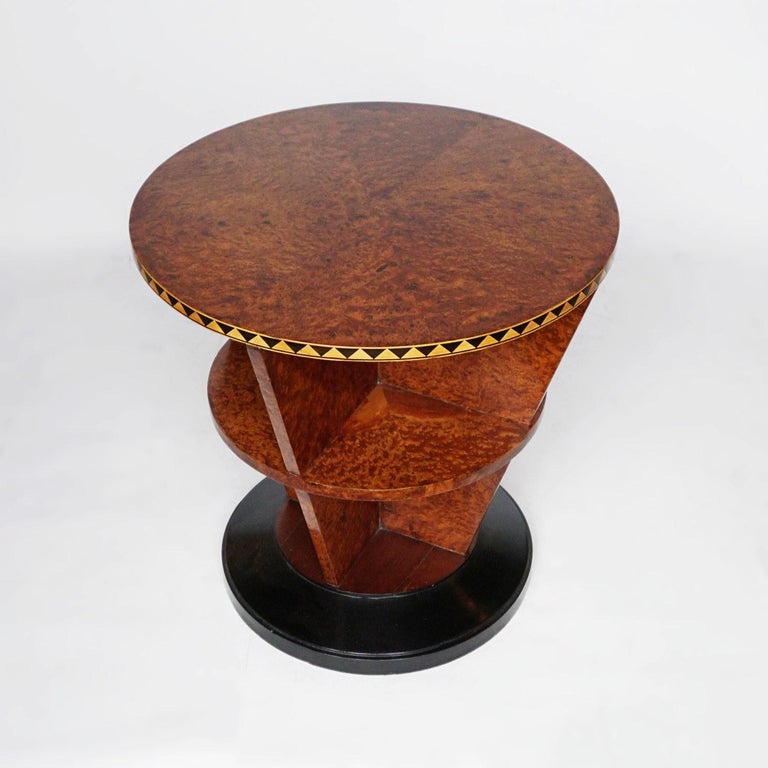 An Art Deco, conical shaped library table. Veneered amboyna with decorative triangular banding. 

Dimensions: D 65cm, H 65cm

Origin: French

Date: circa 1930

Item no: 2402211

All of our furniture is extensively polished and restored
