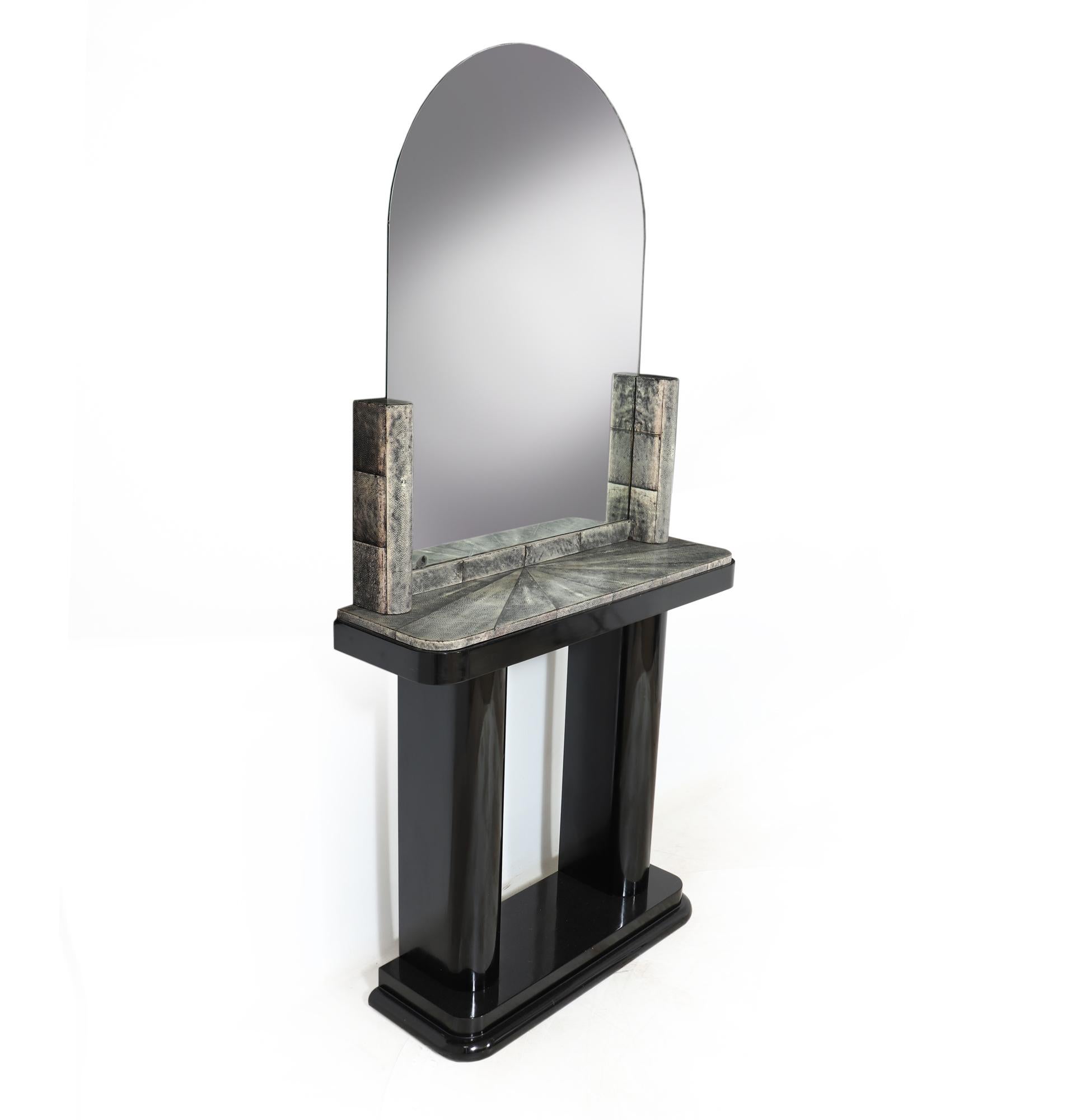 ART DECO CONSOLE AND MIRROR WITH SHAGREEN
This rare art deco console and mirror set is a true gem for collectors and enthusiasts alike. With its ebonised base and luxurious shagreen top, the console exudes elegance and sophistication. The Shagreen,