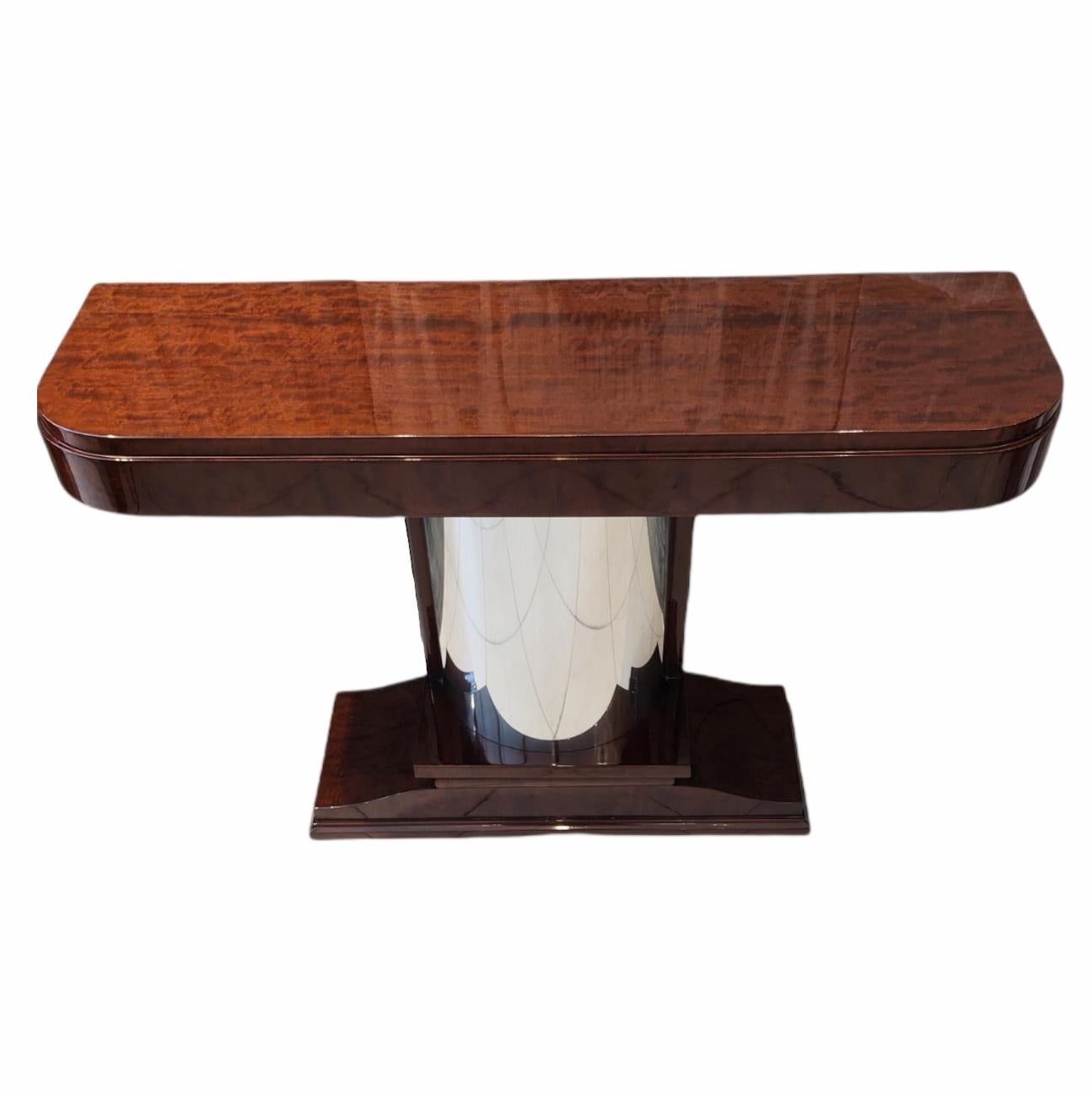 Excellent art deco period console, made of walnut and polished with polyurethane lacquer. the central column is in polished steel and gives the design a luxurious presence.

Art Deco, also called style moderne, movement in the decorative arts and