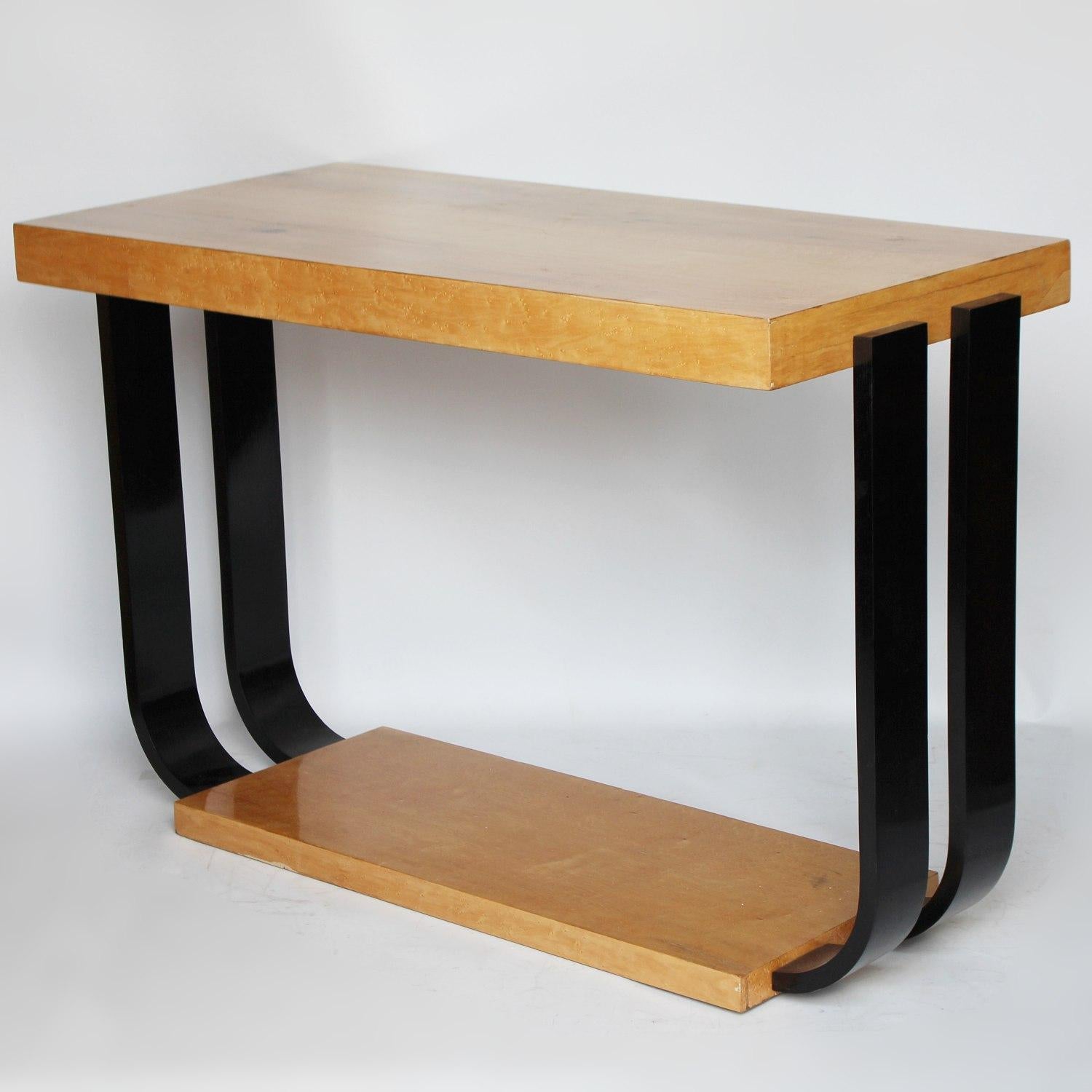 An Art Deco modernist console table. Birdseye maple with ebonized legs creating a U-shaped base.

 