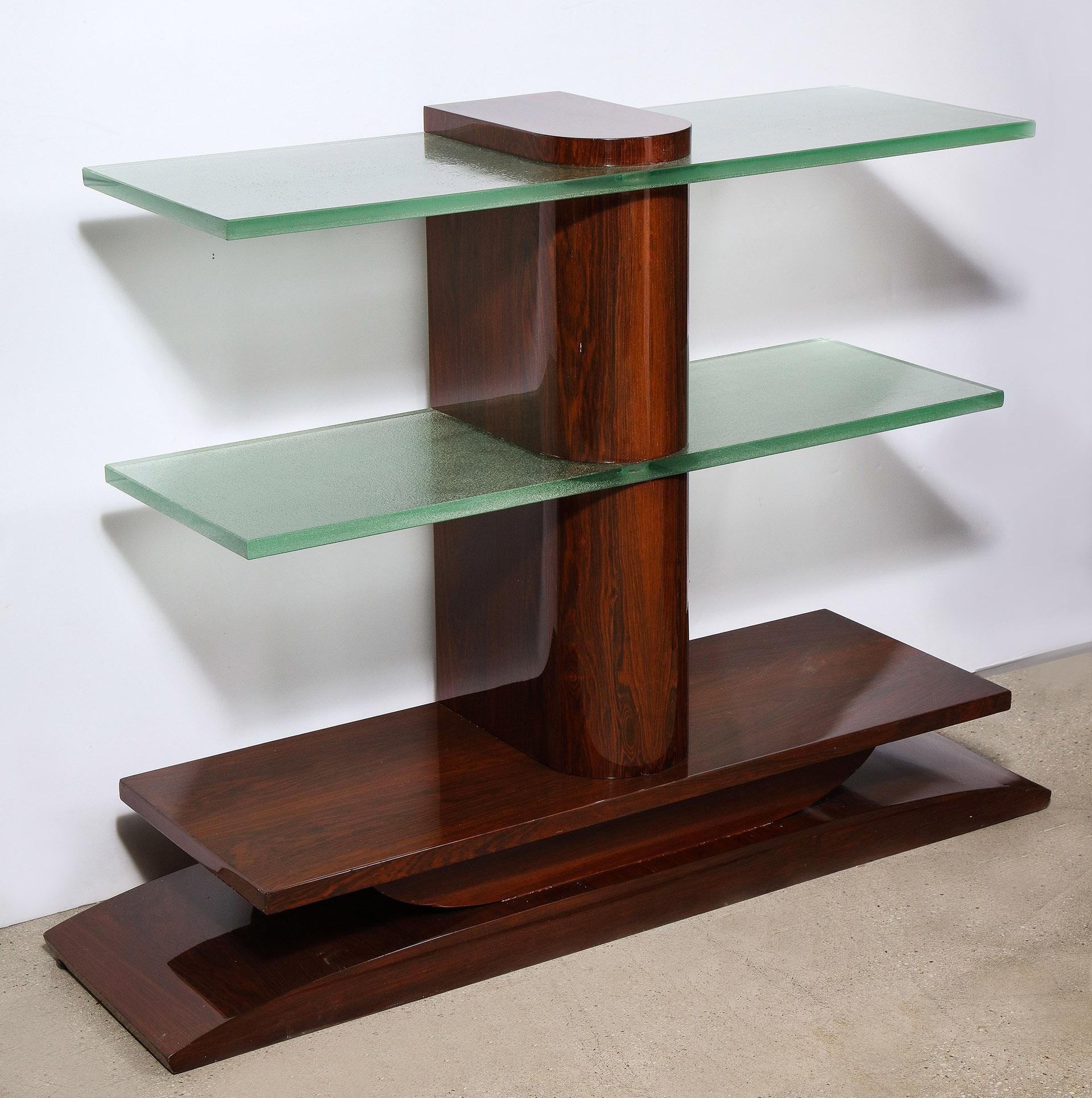 The Palisander veneered console with two Gobain glass shelves supported by a central column on a stepped base.
