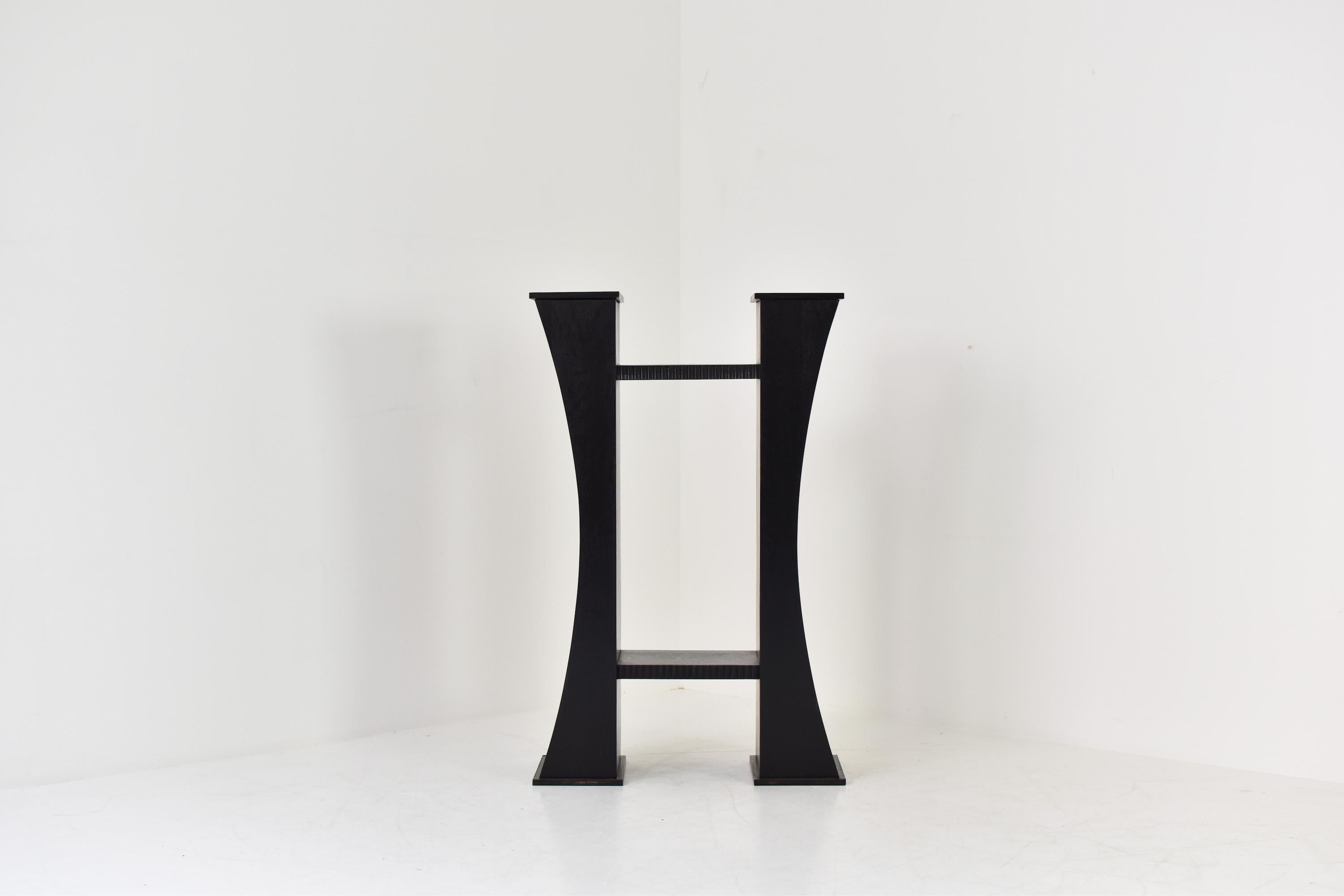 Art deco console table from France, 1930s. This unit is made out of black lacquered wood and is fully symmetrical. Can be displayed in the middle of a room as a centre table. Restored with love.