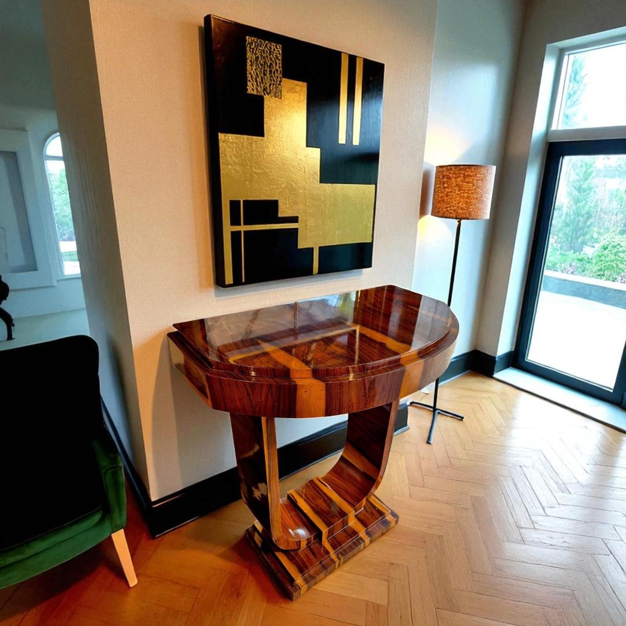 Console crafted in the Art Deco style, made from exotic wood veneer, likely rosewood or palisander, carefully selected for its spectacular grain and natural contrast. The piece features an architectural structure typical of the Art Deco movement,