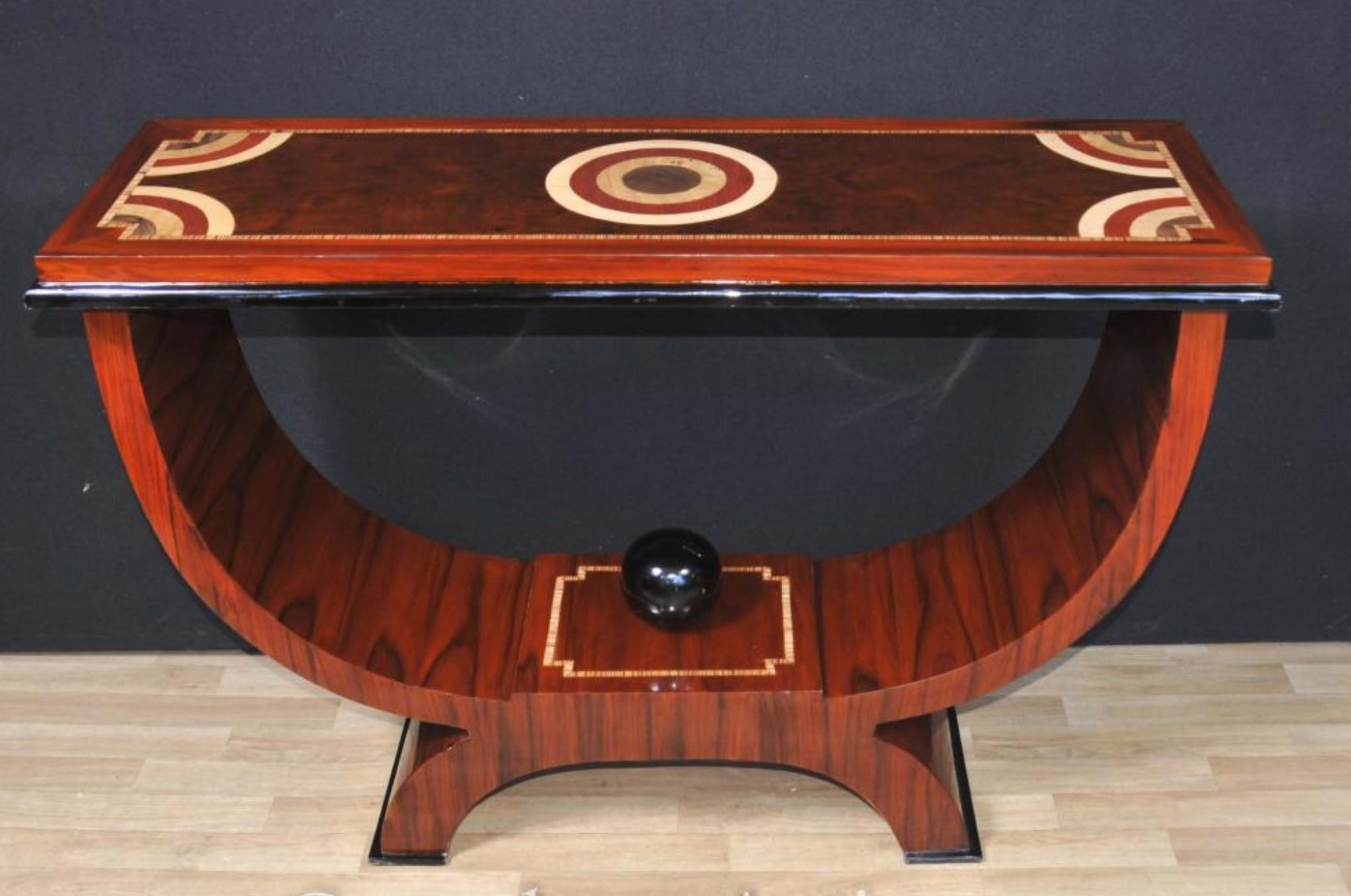 Stunning Art Deco style console table in rosewood
Gorgeous piece somehow epitomize the 1920s aesthetic
Perfect complement to any high end interiors scheme
Love the concentric inlay motifs to the table top, very stylish
Offered in great shape