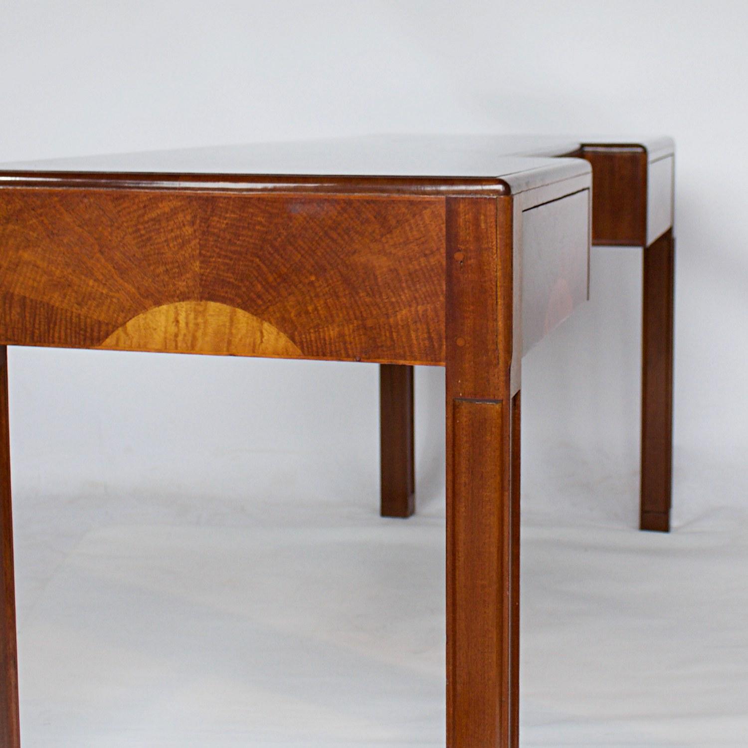 An Art Deco console/sideboard by Betty Joel (1894-1985. Satin Mahogany veneered on solid oak, with 'sunrise' bleached' crescent detail to front of drawers and sides. Three integral drawers. Labelled and dated 1929 to back.

Full