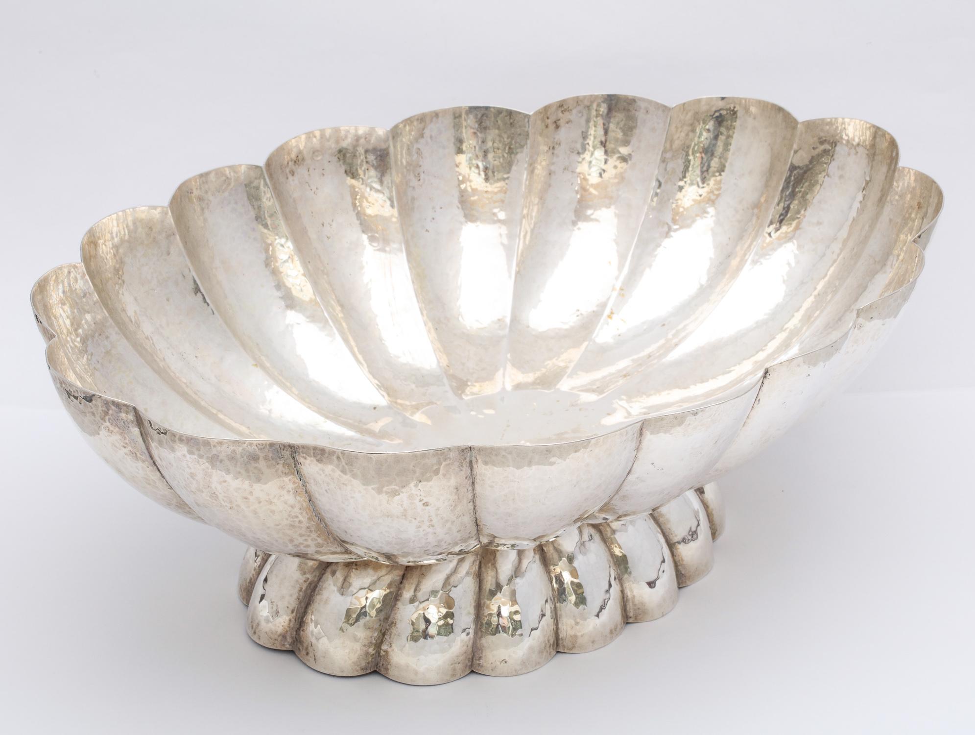 Art Deco, continental silver (.800), scalloped, hammered, pedestal-based centerpiece bowl, Austria, circa 1925, Bruder Frank, maker. Measures over 13 1/2 inches wide x 9 3/4 inches deep x 4 3/4 inches high. Weighs 27.865 Troy ounces. Dark spots in