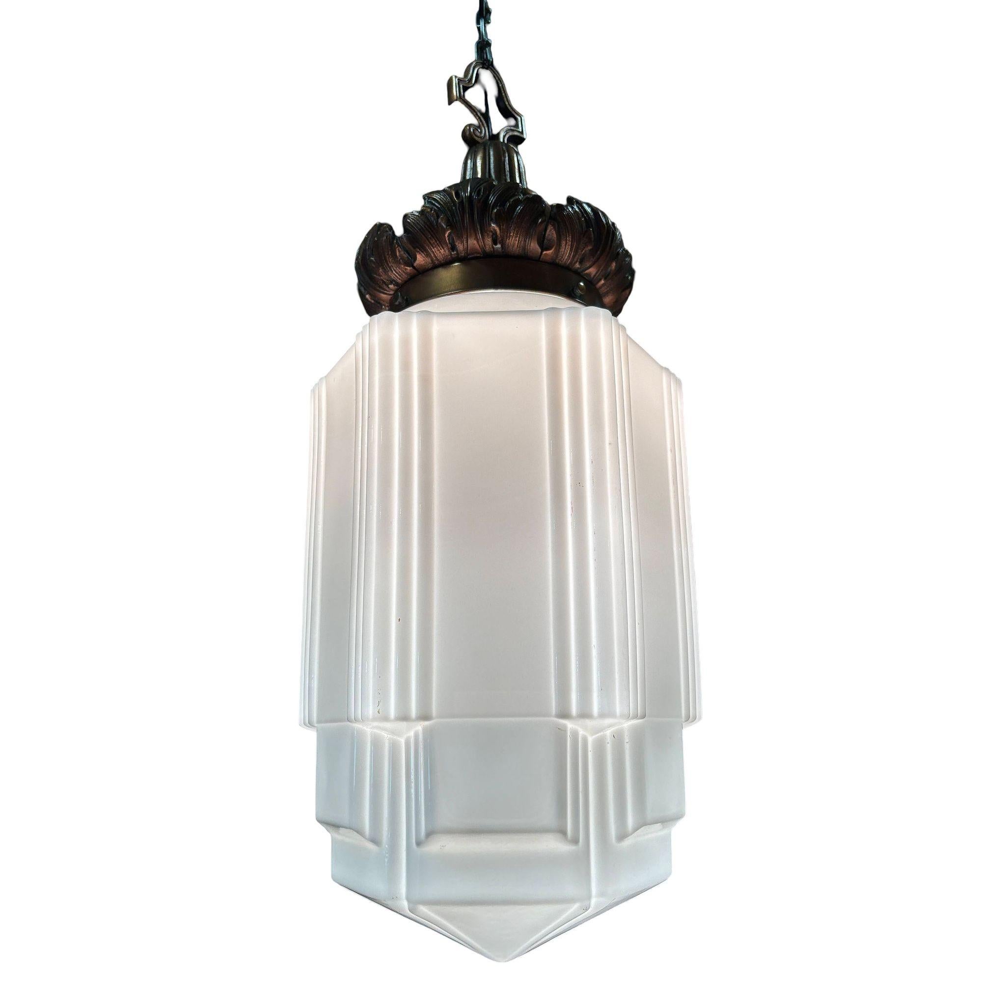 1930s Art Deco pendant light featuring a stepped and line-textured 