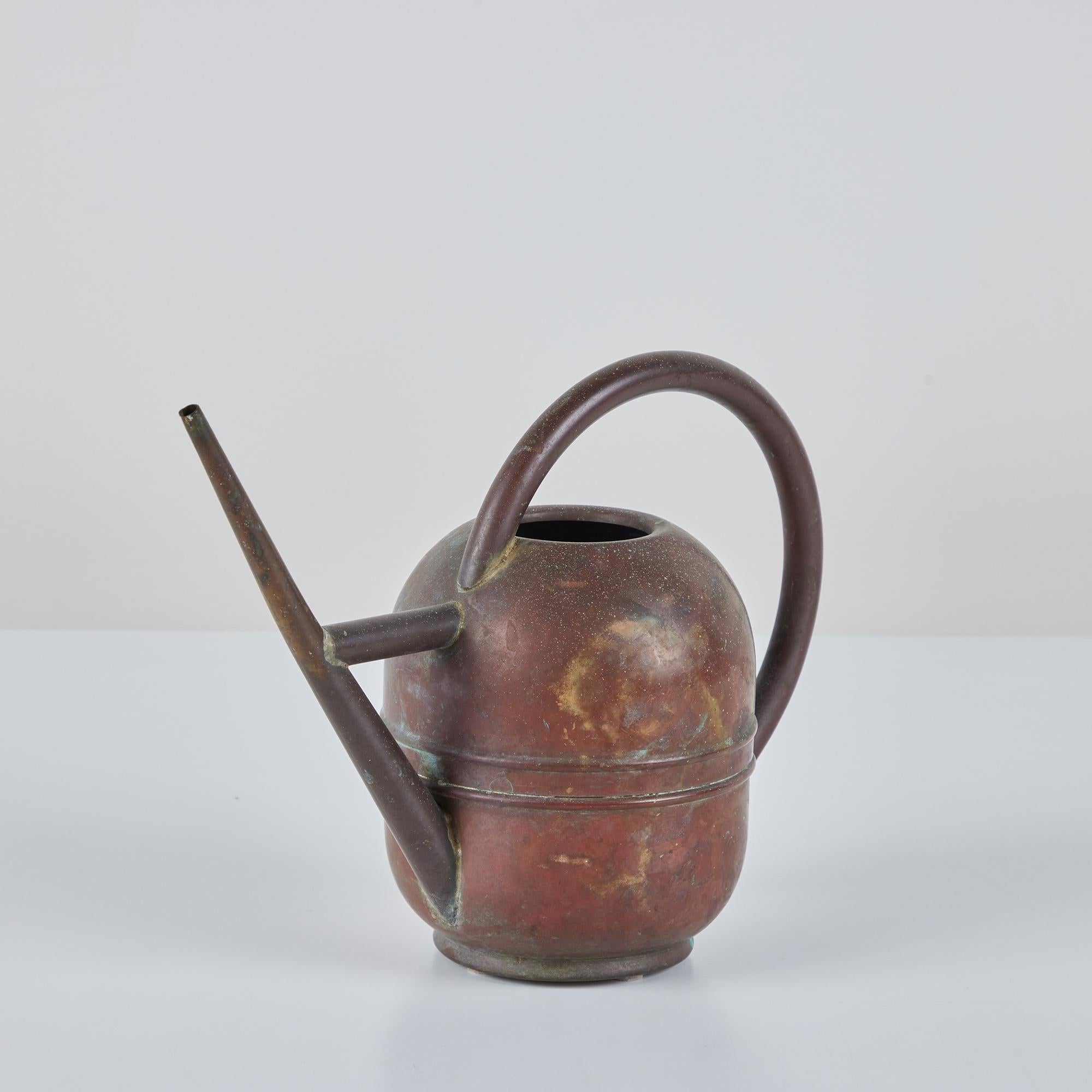 Art Deco copper and brass watering can circa 1930s, Chase USA. This piece features a copper body and brass handle and spout. Vessel is impressed with [Chase USA] and feature the Chase Centaur Archer logo on the underside.

The Chase Brass and
