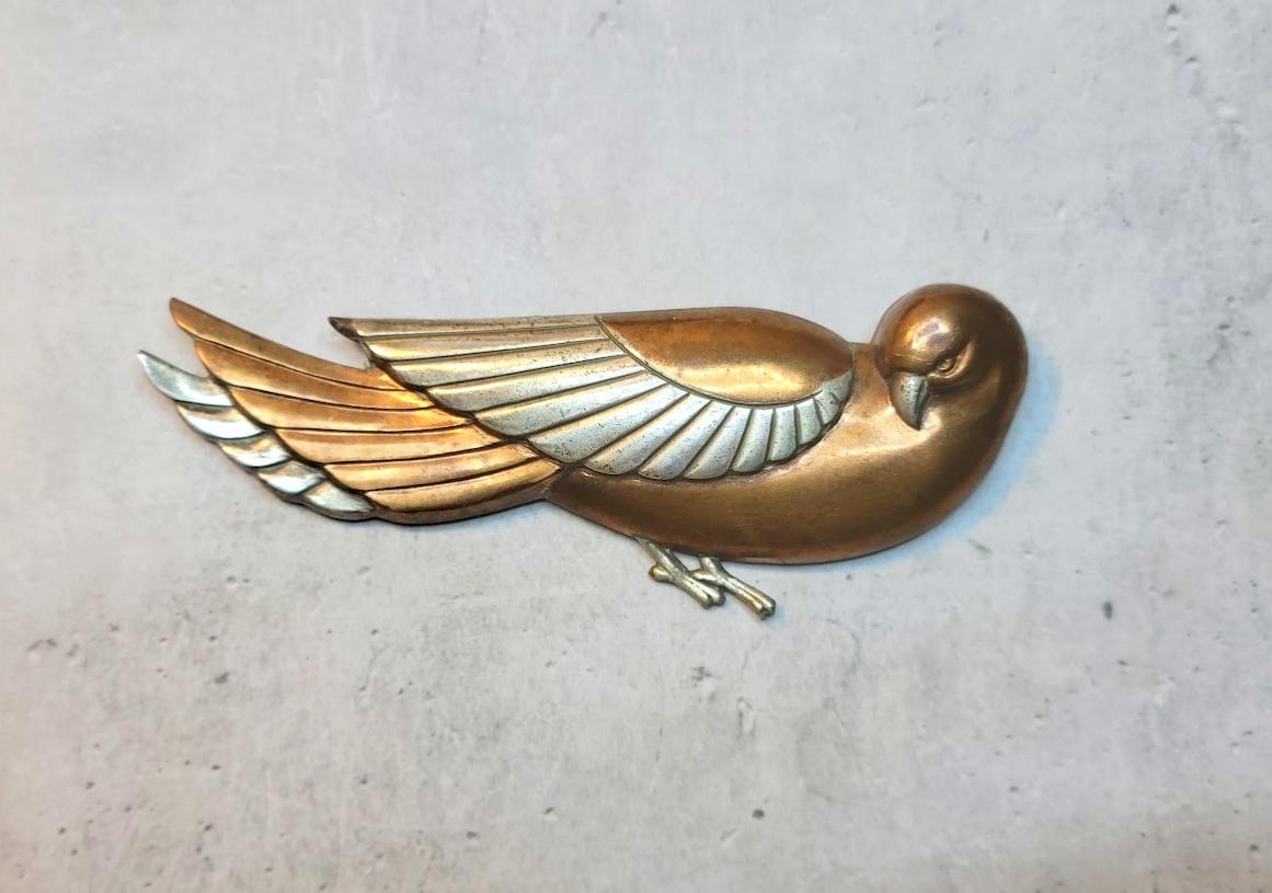 Introducing a magnificent Art Deco Sterling Silver Dove Bird Pin that exudes timeless elegance and a touch of edge. Measuring an impressive 3.5” (90mm) in length and estimated to be from the 1930s-1940s era, this brooch is a rare find that is even