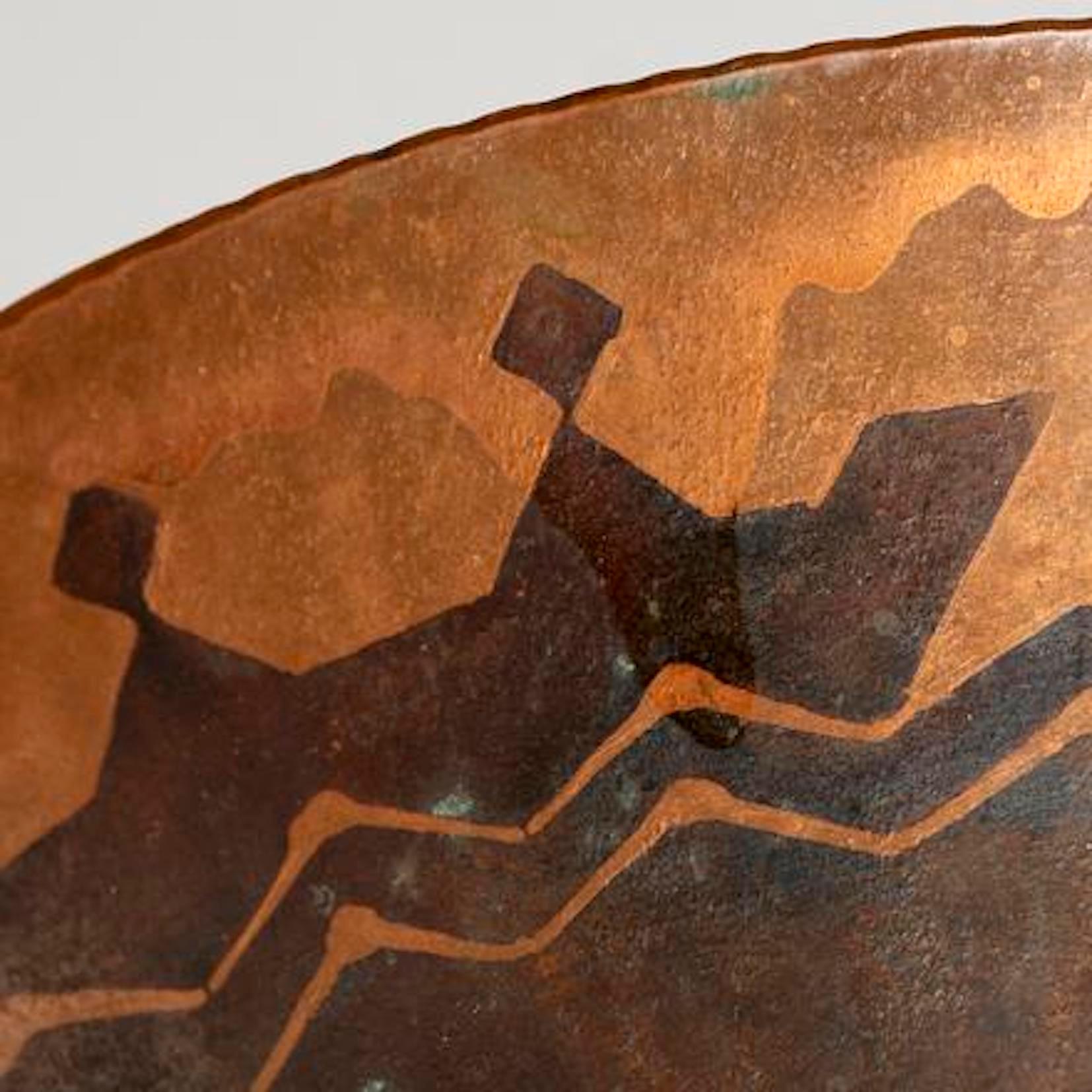 Walter Von Nessen Studio, Art Deco copper bowl 
c. 1927, USA, hammered copper sheet metal, the
exterior and interior bowl decorated with Nordic
style geometric bands and fish in dark patination
 Stamped: 
