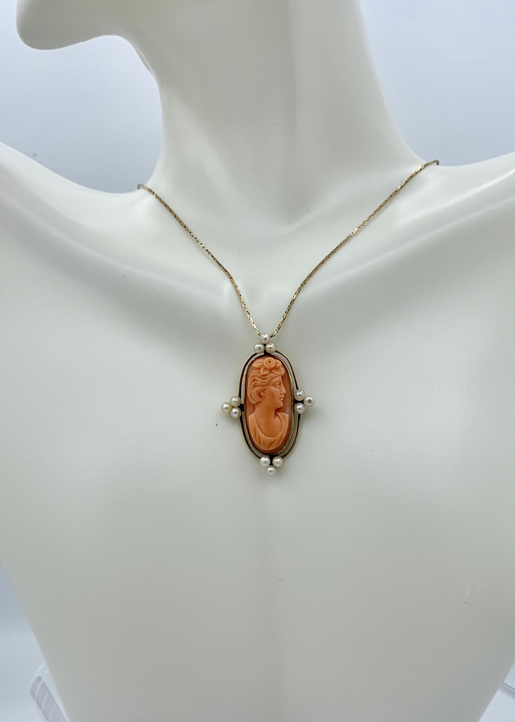 This is an absolutely stunning antique Coral Cameo Pendant depicting a Neoclassical Woman or Goddess dating to the Victorian to Art Deco period.  The Coral Cameo is an exquisite hand carved cameo with masterful carving of the head of the Goddess or