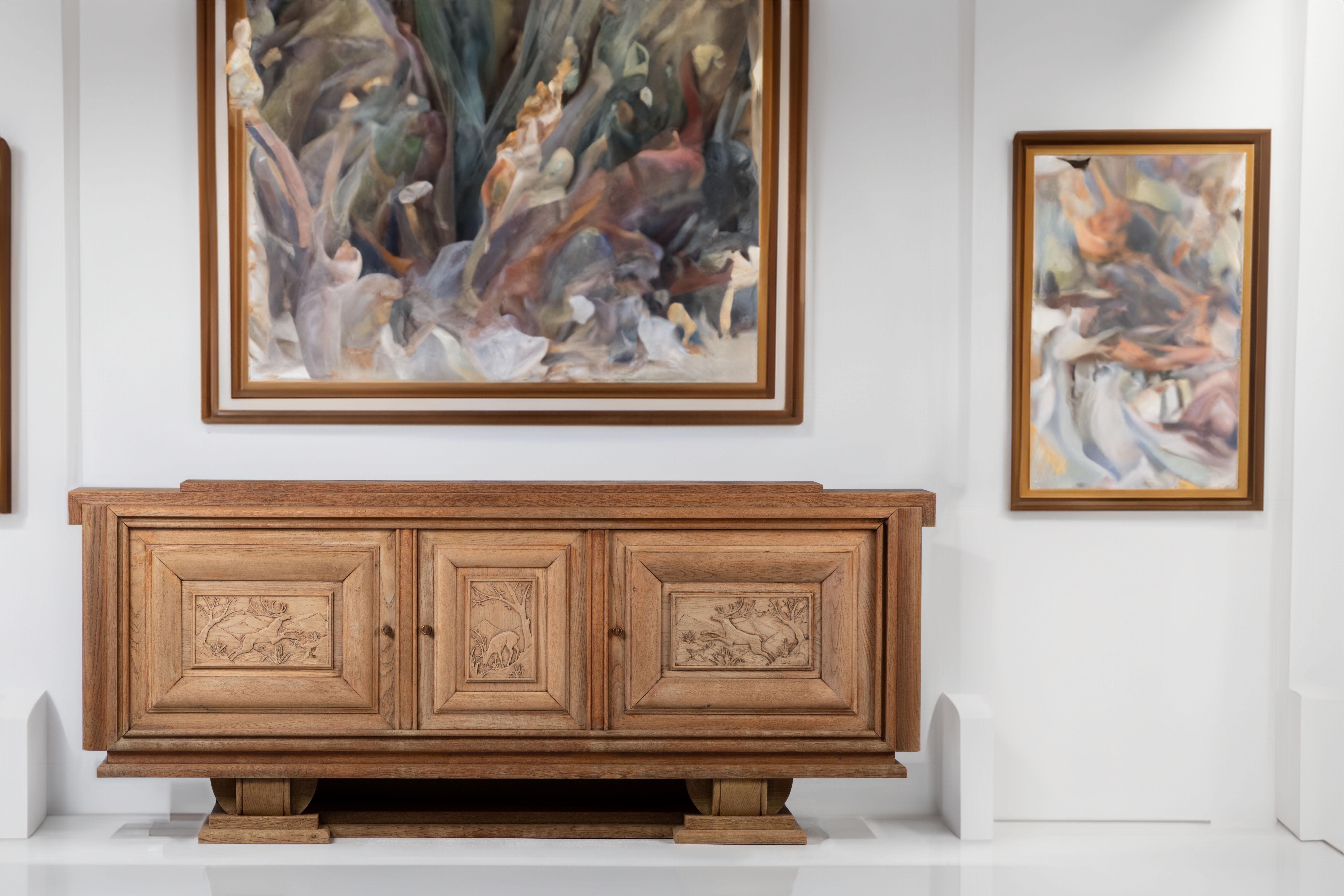 Experience the rustic charm of a hunting lodge with this remarkable vintage Art Deco Brutalist sideboard. Crafted in France during the 1940s, this piece exudes a sense of timeless elegance and pays homage to the hunting traditions of the