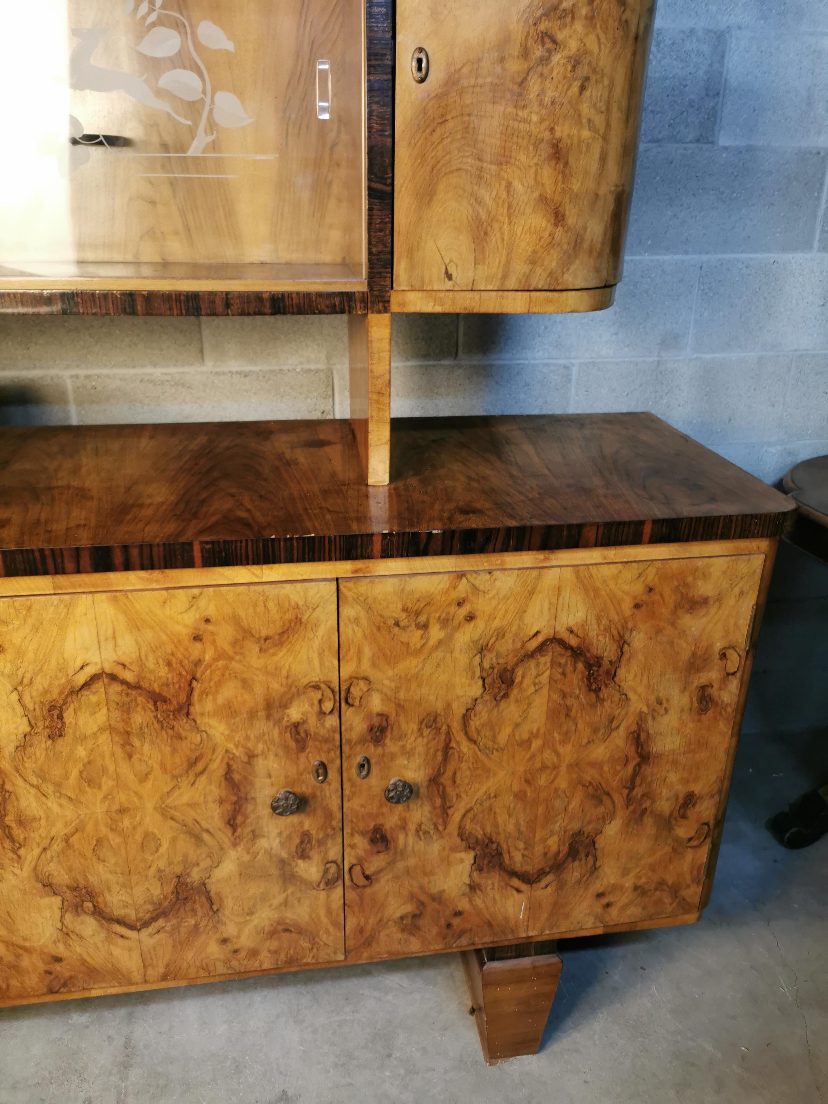 Art Deco credenza sideboard in burl wood circa 1920 Italy 
credeza 51x170x105H cm 
vitrine 34x136x65H cm vitrine top part can be remove 
total height 170 cm.
 there is fast shipping to italy and europe
italian art deco period credenza