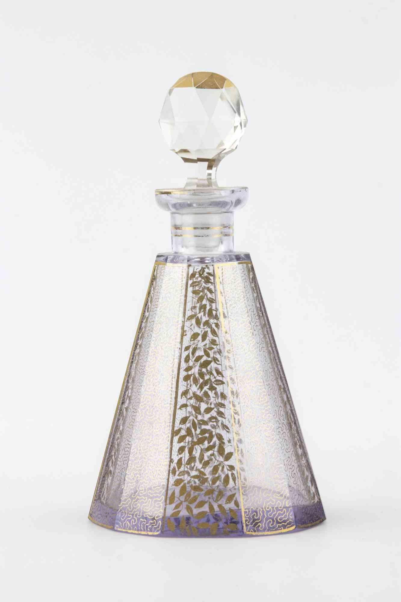 Vintage Art Deco crystal perfume bottle.

Gilded decorations.Attributed to Moser, Austria.

Includes its original cap.

Very good condition.