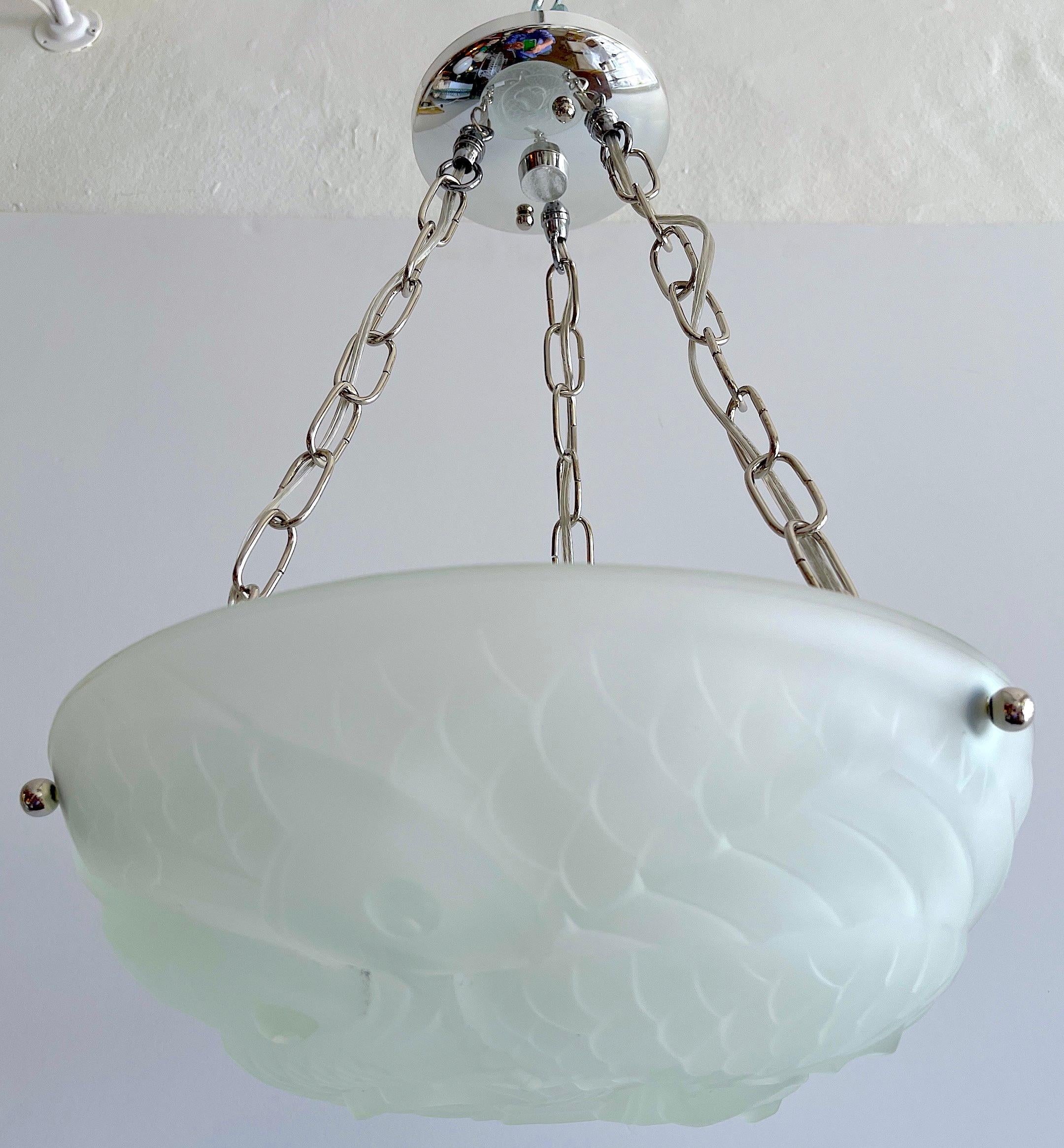Art Deco crystal 'Poisson' chandelier, by Verlys, five available 
Each one with polished chrome mounts, the circular frosted crystal dome with intertwined fish.
New Wiring, fitted with three candelabra bulbs, up to 60W each.
 