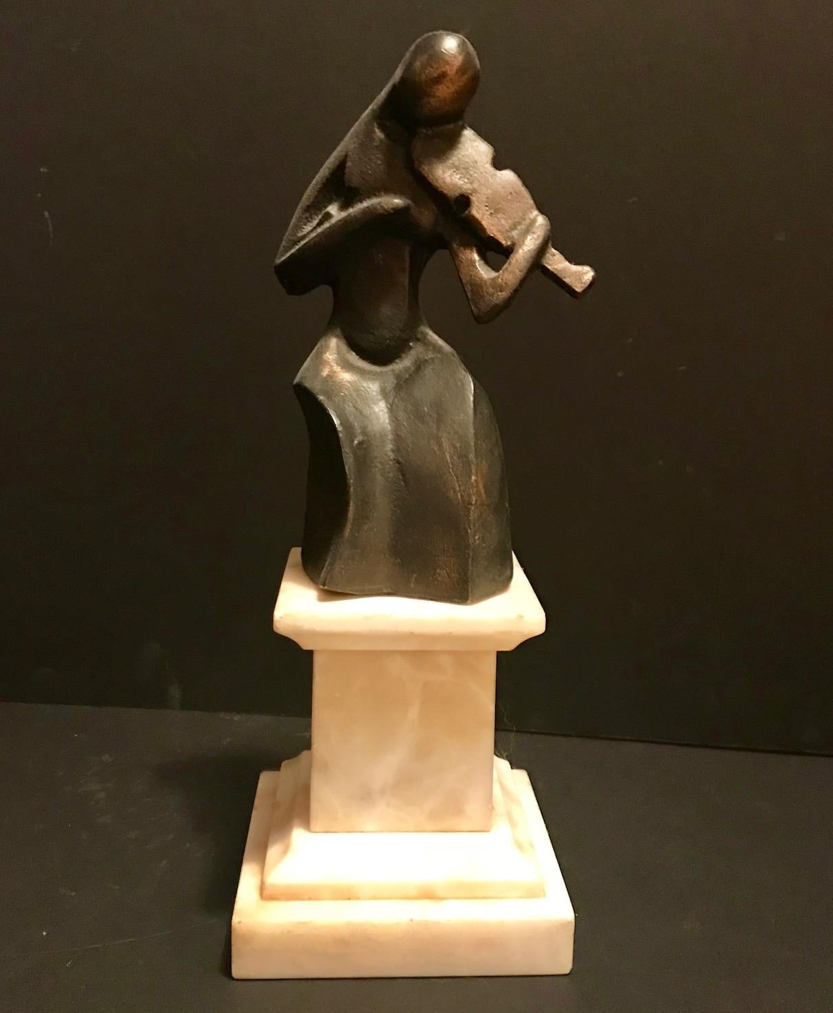 This highly interesting sculpture of a devoted violinist is executed in pure Cubist style. It has a rich dark patina. The bronze statue is mounted on an alabaster plinth. Underneath the base is a paper label attached which states, PABLO CURATELLA