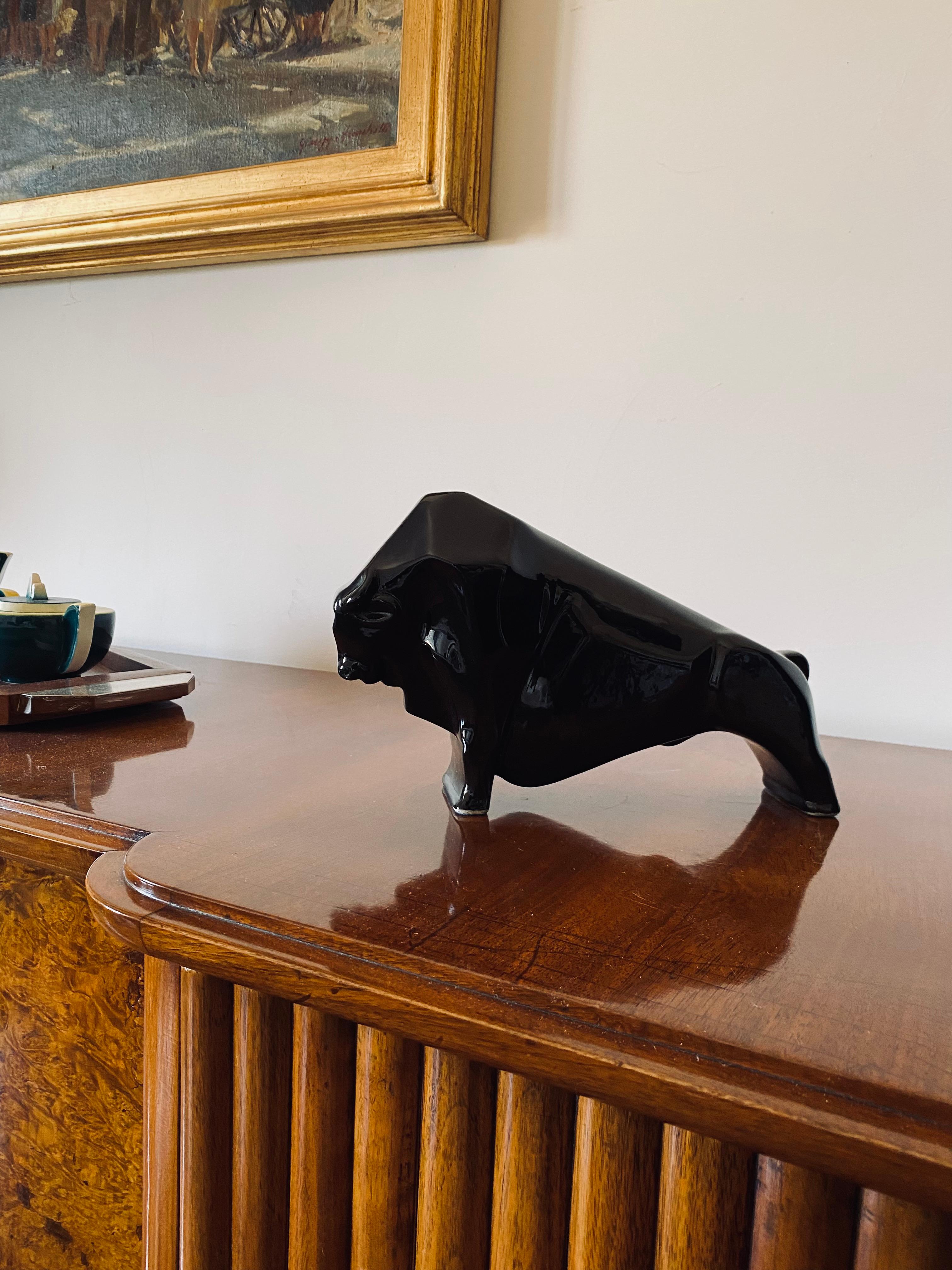 Art Déco cubist ceramic sculpture in the shape of a black bull

France ca. 1940

Measures : 28 x 16.5 x 8 cm

Conditions: Excellent, no dents o chips.