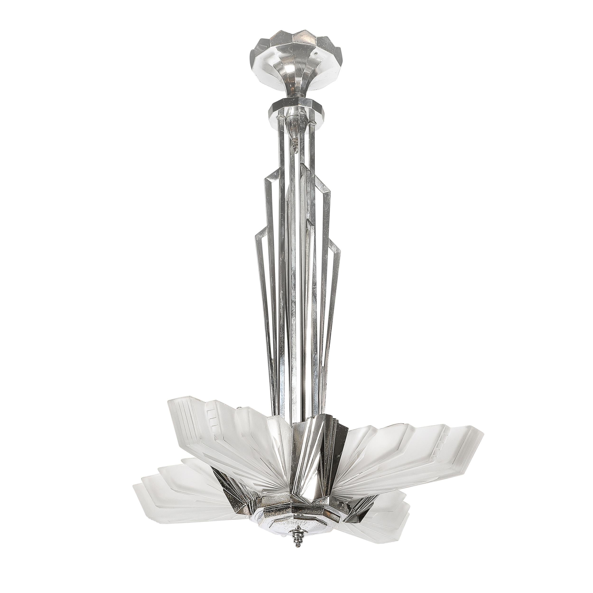 This breathtaking Art Deco Cubist Skyscraper Style Chandelier in Frosted Glass & Nickeled Bronze signed Petitot originates from France, Circa 1930. Features four molded and frosted glass shades with a striking skyscraper style stepped composition