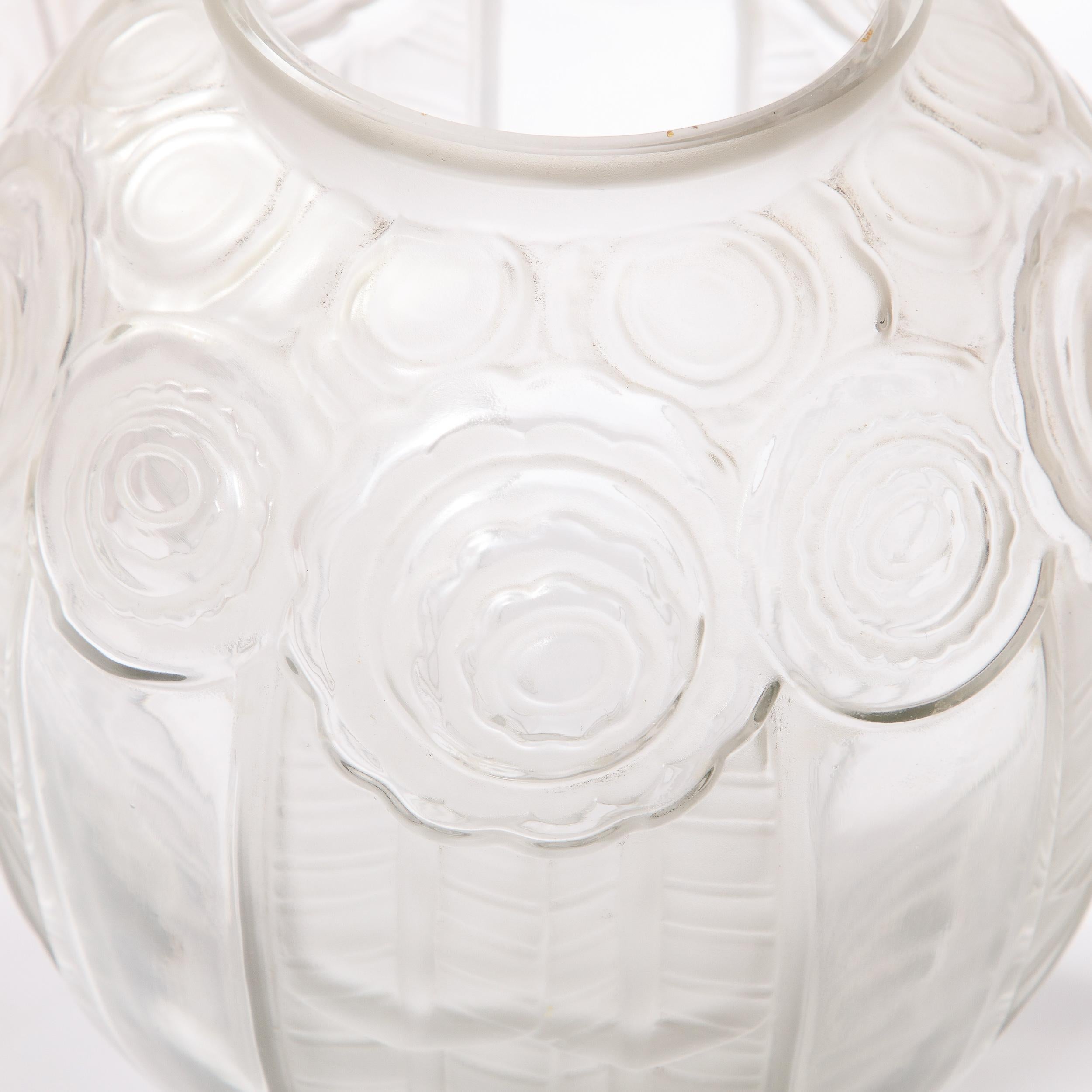 This stunning Art Deco vase was realized by the esteemed atelier of Andre Hunebelle (one of the finest glass makers in France during the period) circa 1930. It offers a robust cylindrical body that flares in the center and tapers at top and bottom.