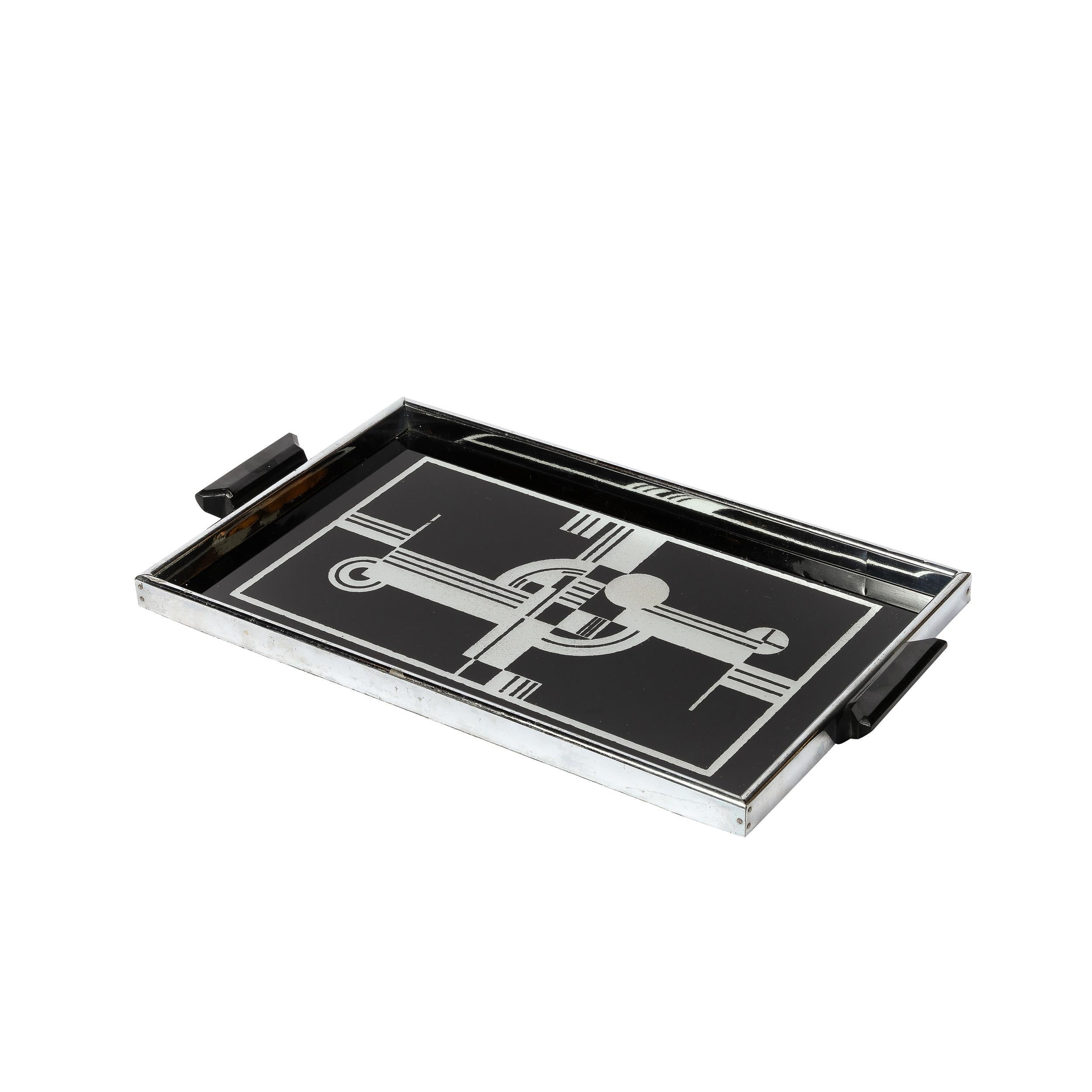 This beautiful Art Deco Serving Tray originates from the United States, Circa 1935. Beautifully composed in black and white geometric forms, this is a highly desirable and collectible piece. Lined in Polished chrome with handles composed of Black