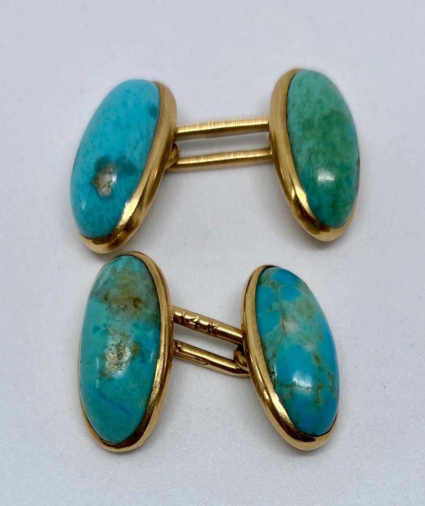 Rare, highly unusual, elongated oval cufflinks featuring four bright blue turquoise cabochons in 14K rose gold settings by Larter & Sons.

The oval faces each measure 16mm by 8mm; together, the cufflinks weigh 6.93 grams.

They bear the Larter &