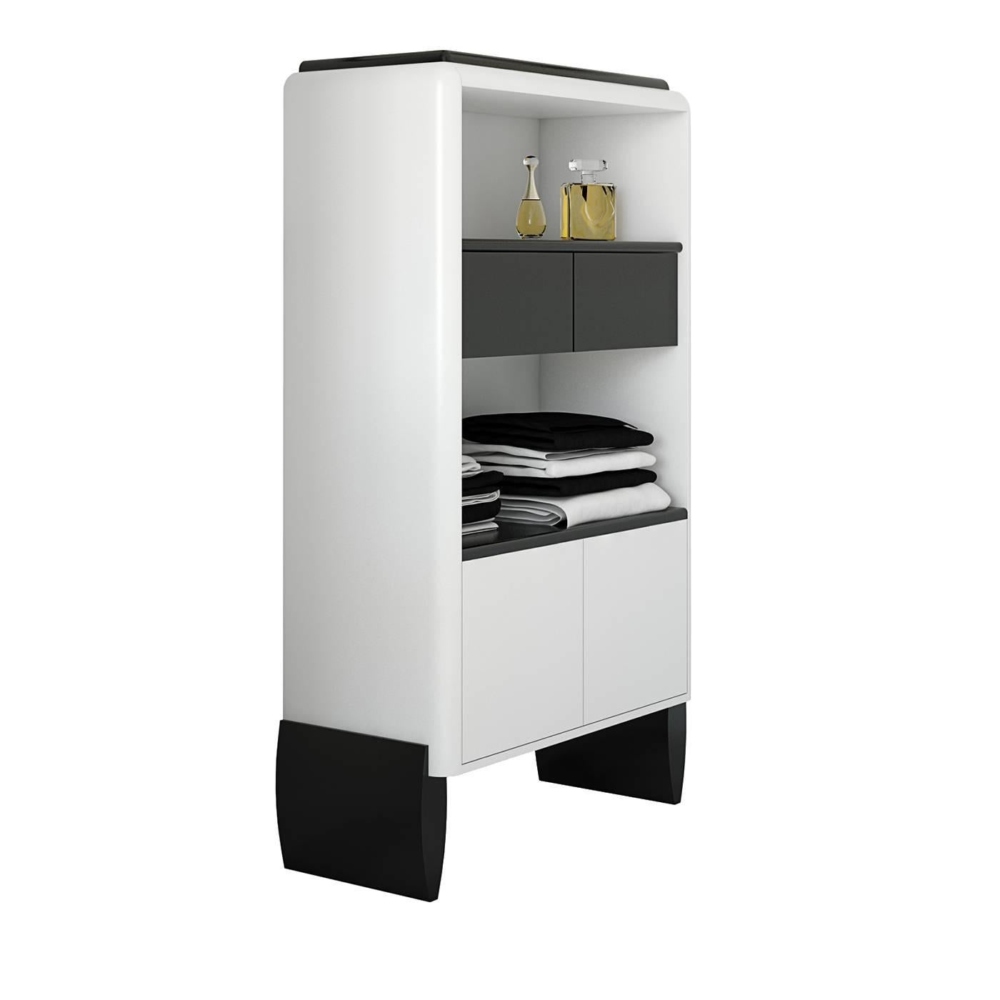 This striking cupboard is a versatile and precious addition to a modern or contemporary decor. Inspired by the bold style of Art Deco furniture, it boasts a matte white and black finish that create a timeless color combination. Standing on four