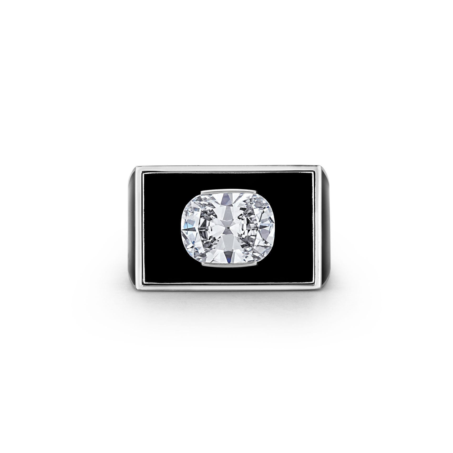 This ring is simply a matter of black and white.  With a shiny black lacquer finish and a vivid white cushion brilliant cut center diamond, this ring is architecturally striking and sleekly modern.  Mounted in platinum and 18 karat white gold, this