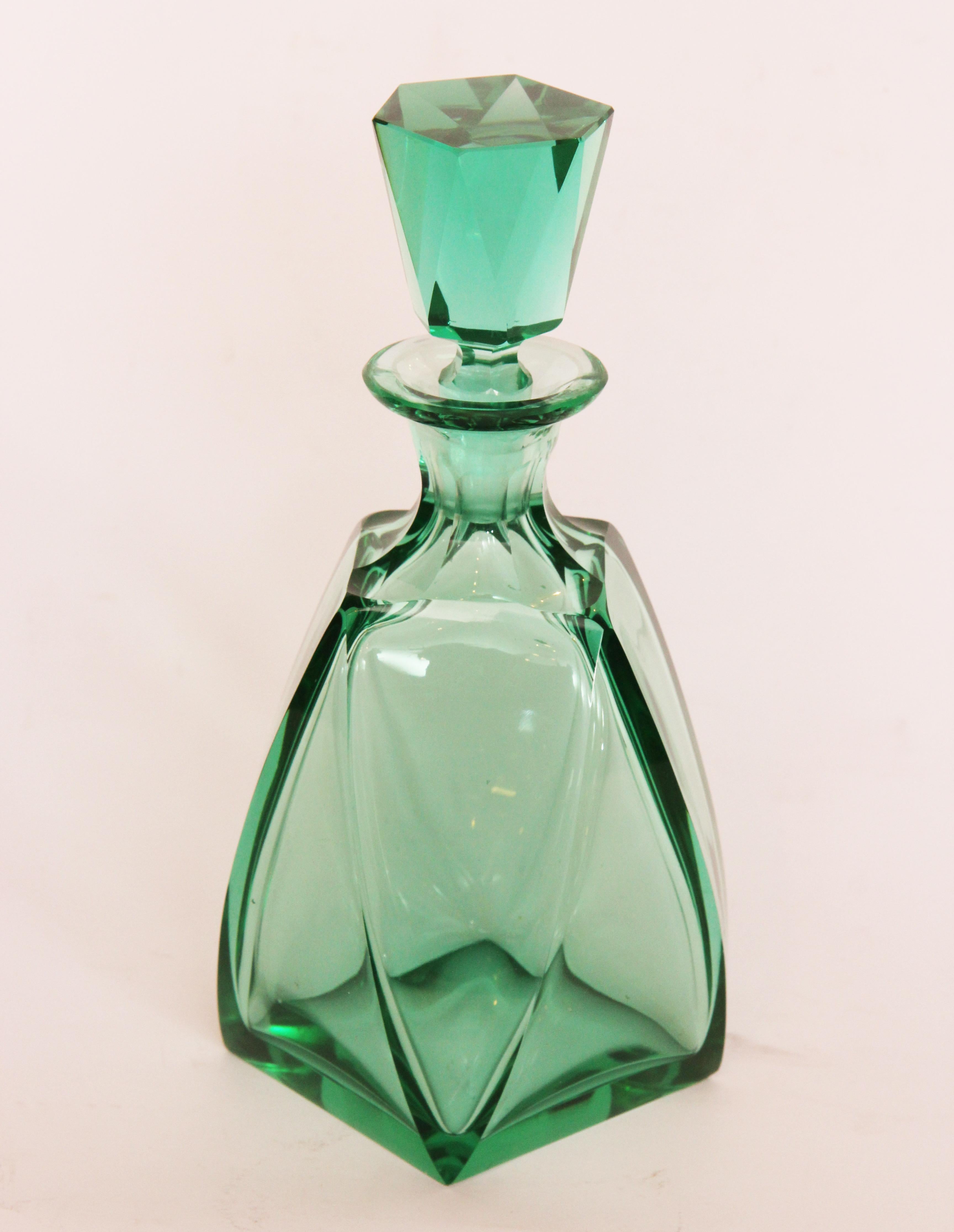 Art Deco cut crystal liquor set.
Measures: Bottle - H 25cm, W 12cm, D 12cm 
Glass - H 8cm, W 9cm, D 9cm.
Czech, circa 1930.