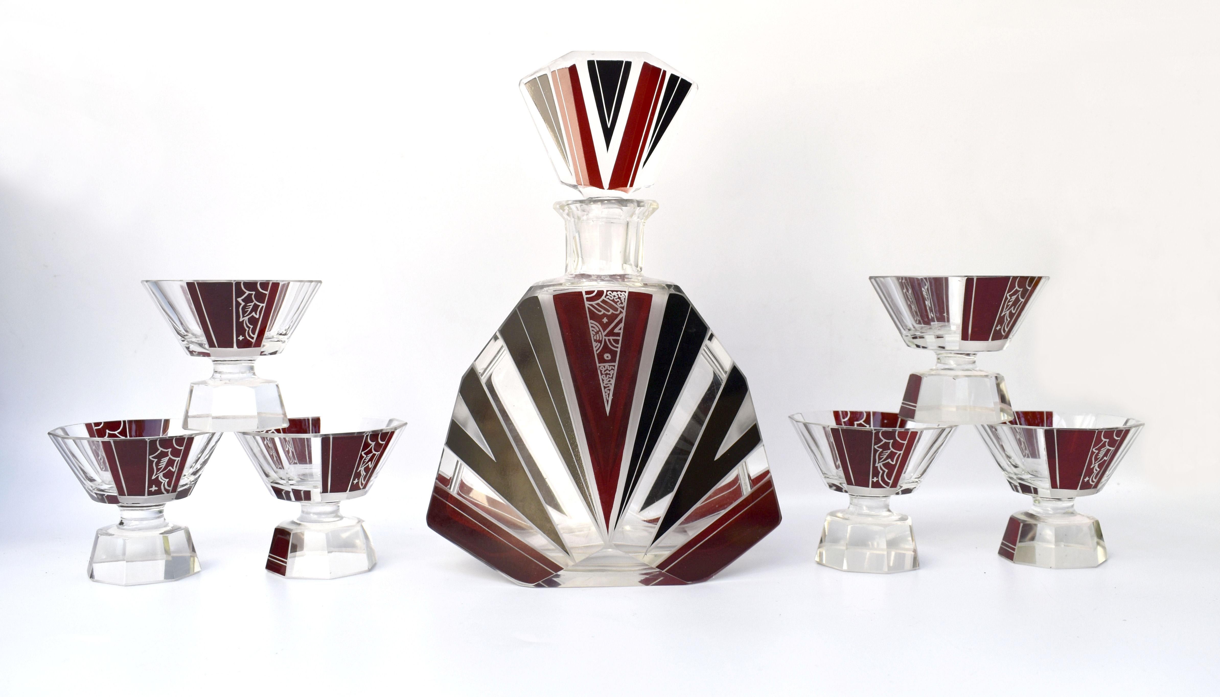 Totally authentic and wonderfully stylish 1930's Art Deco decanter set. Comprises a large decanter and six matching glasses. This fabulous set exudes quality as soon as you hold each piece, each being deceptively heavy and wonderfully detailed. The