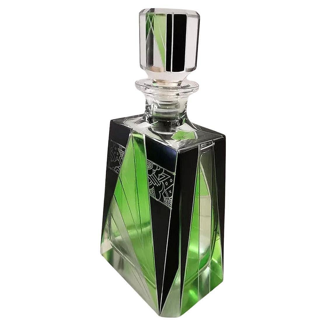 Very high quality, very striking looking 1930's Art Deco Czech glass decanter set. Features a classic shape crystal decanter with stopper and six decent sized glass tumblers . The whole set is enamelled in lime green and black enamel with acid