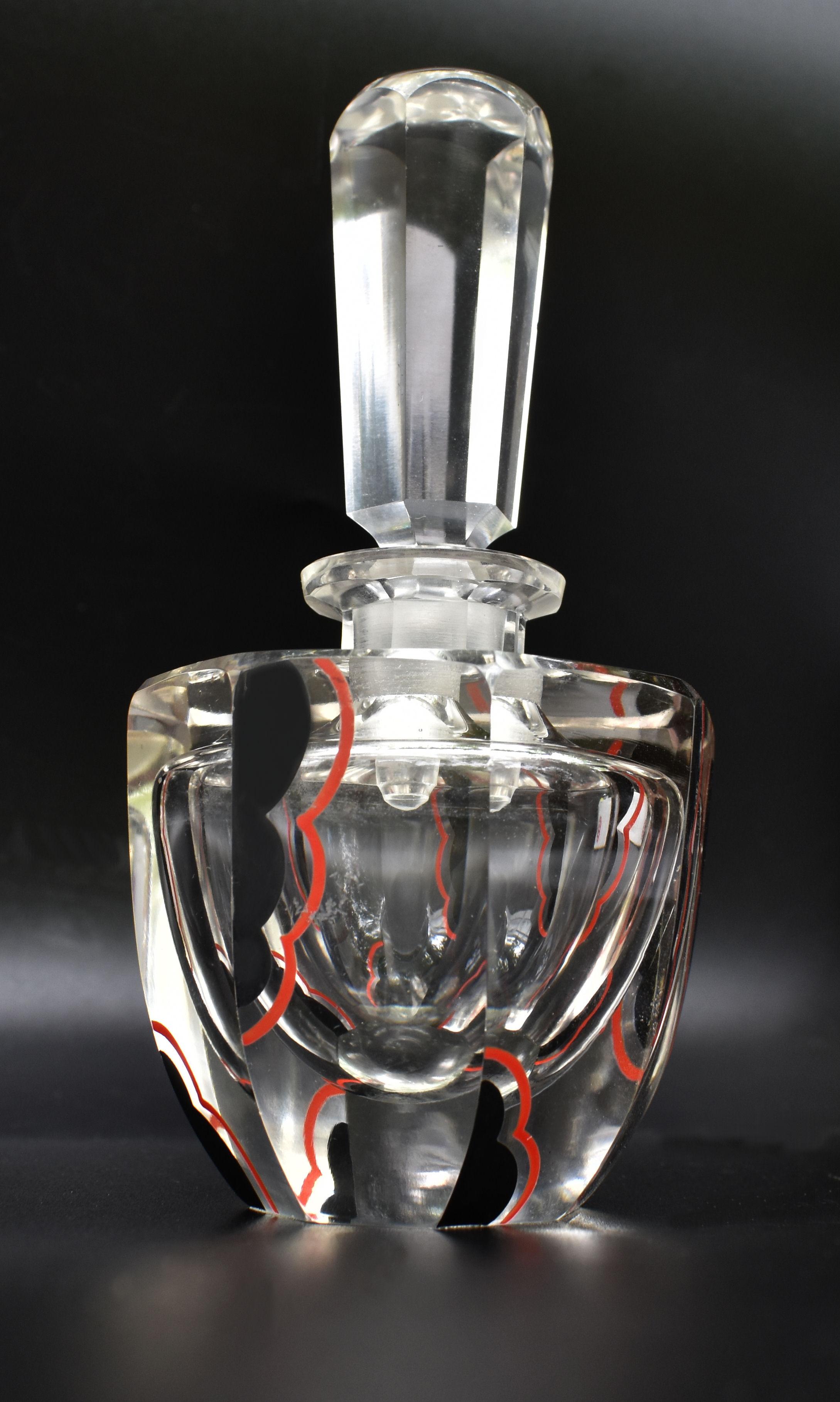 For your consideration is this extremely stylish Art Deco cut glass scent bottle, dating to the 1930's and originating from England we believe. Fabulous enamel decoration with stylized clouds in black with lipstick red accents on every angle,