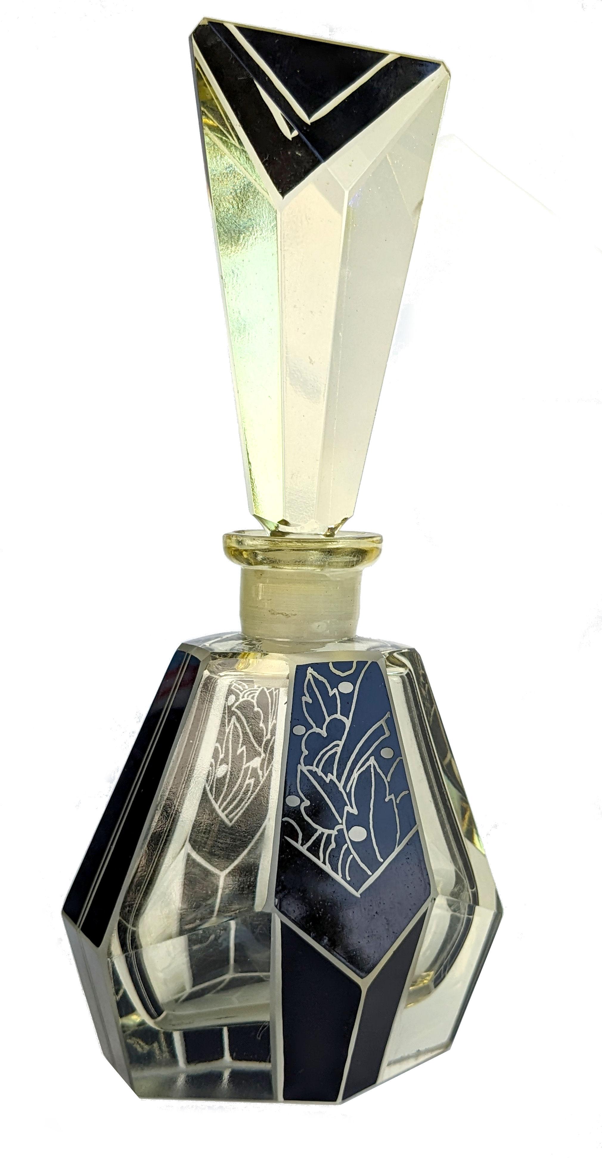 Art Deco large cut glass perfume scent bottle, dating to the 1930's and originating from Czech republic. In lemon yellow cut glass with jet black enamelled geometric design. Glass cut glass stopper. Manufactured in Czech republic in the 1930s this