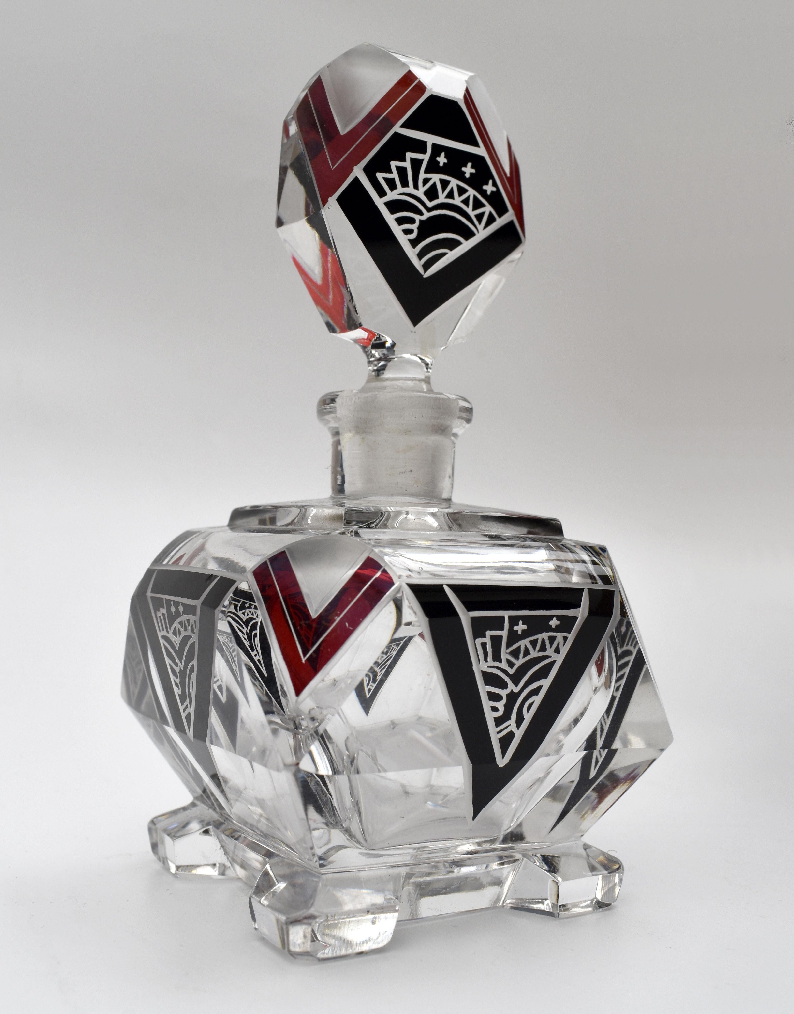 For your consideration is this wonderful Art Deco cut glass scent bottle with a very attractive and iconic shape and patterning with geometric dark red & black enamel decoration with acid etched detailing to both the body of the bottle and stopper.