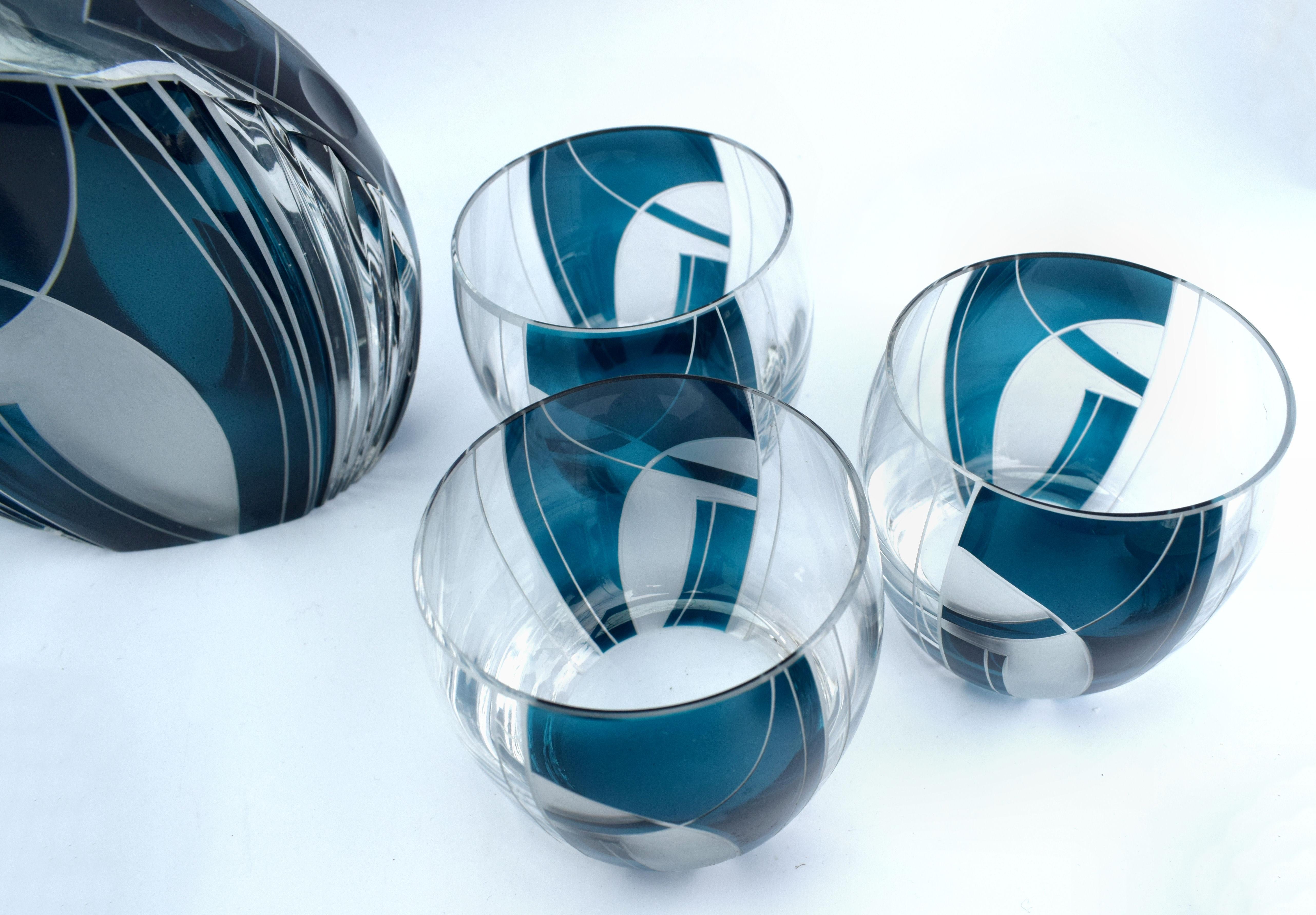 Very high quality, collectable 1930s Art Deco Czech whisky decanter set in heavy cut glass. Fabulous geometric patterns lavishly adorn each piece with blue and black enamel overlay with etched decorative lines. Features a Classic shape crystal