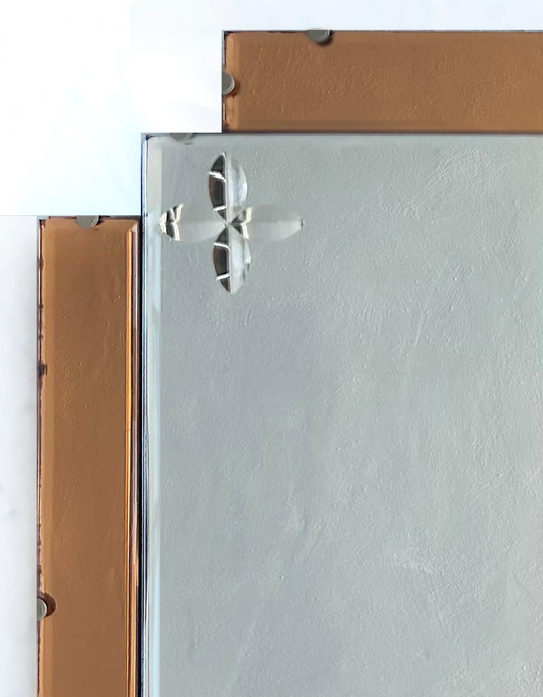 Art Deco Wheel Cut Mirror w Peach Mirrored Panels, Wired and Ready to Hang

Offered for sale is an Art Deco etched mirror with peach colored mirrored panels on all sides with copper-wheel cut etched corner details.  The mirror is mounted on a wood