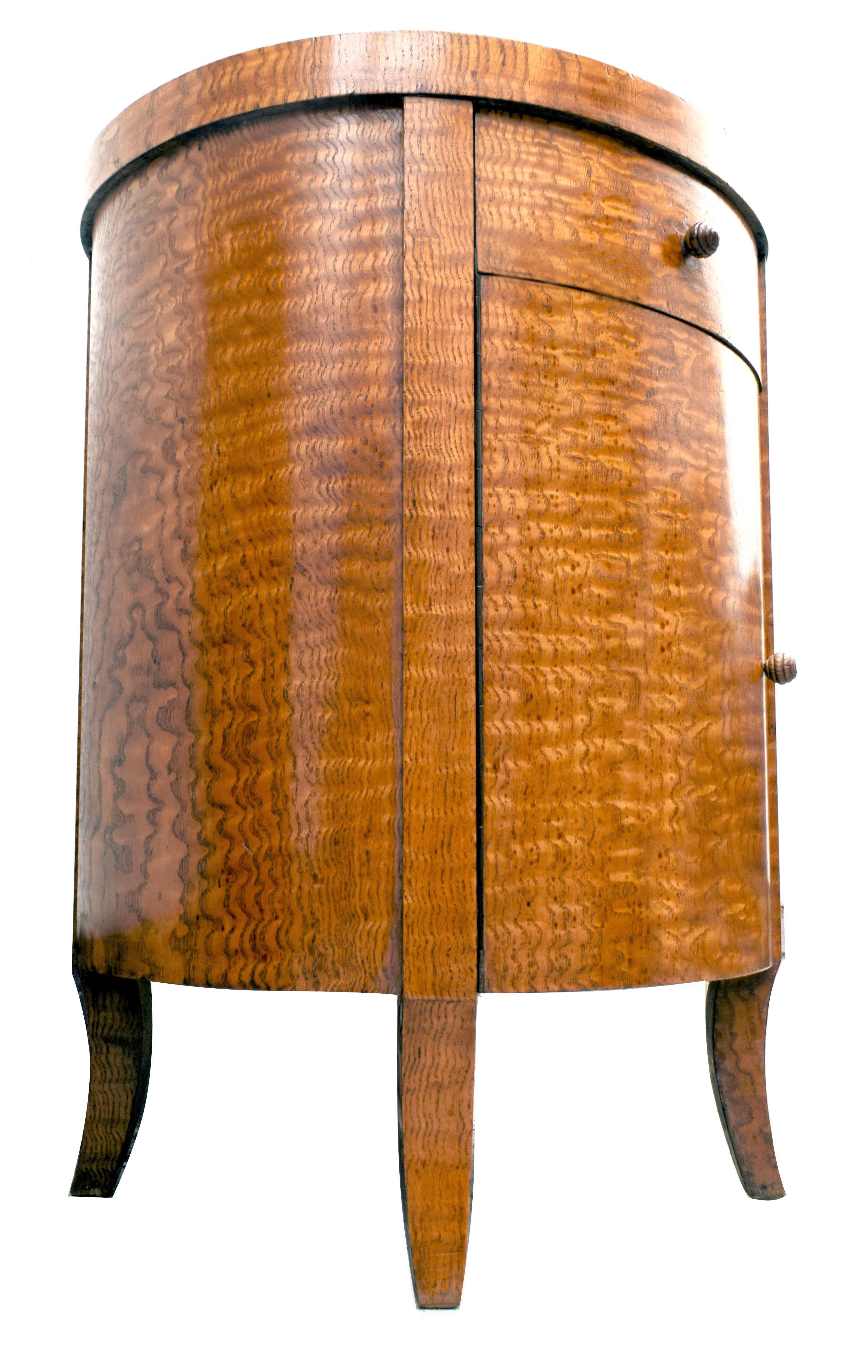 For your consideration is this hugely stylish and rare Art Deco circular cabinet in the rare veneers of Chinese burl ash, a very expensive wood of its time and consequently rarely used or seen. Blonde in tone this piece easily integrates with other