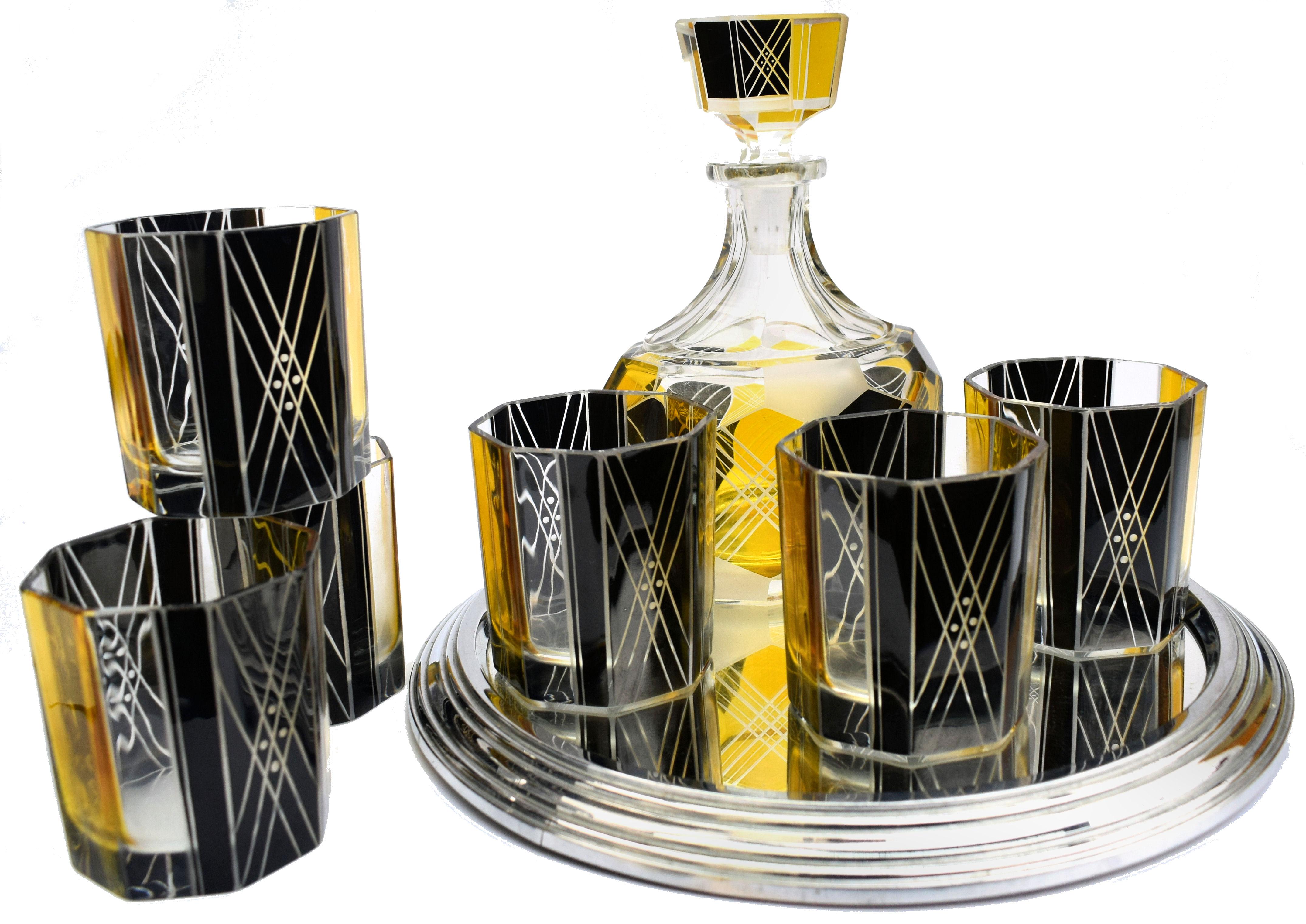 Very high quality, very striking looking 1930s Art Deco Czech glass decanter set. Features a Classic shape crystal decanter with stopper and six decent sized glass tumblers. The whole set is enameled in yellow and black with etching to highlight the