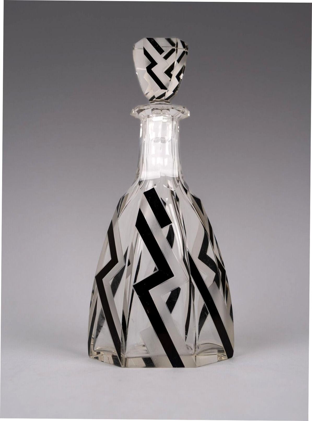 A very attractive Art Deco Czech crystal decanter of large proportions. The Czech glassworks is most famous for its pieces made in the period of 1930's when striking and inventive geometric designs became a departure from the classic two toned