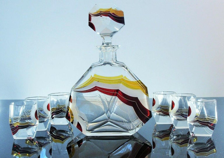 Very high quality, collectible 1930s Art Deco Czech decanter set by Karl Palda. Features large crystal decanter with six shot glasses, hand blown crystal with diamond polished edges. The set is both enameled and engraved with beautiful detailing and
