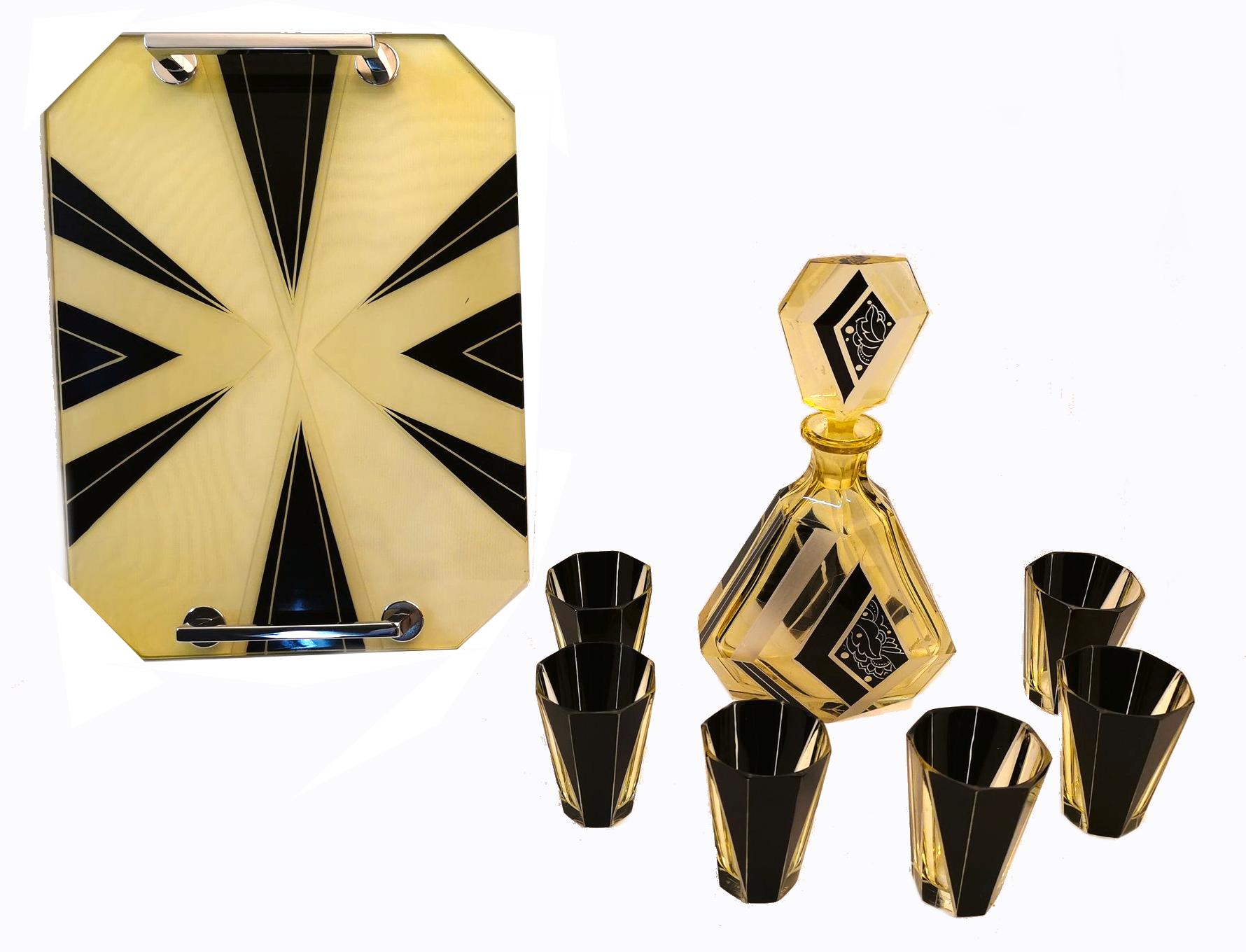 Very high quality, very striking looking 1930's Art Deco Czech glass decanter set. Features a classic shape decanter with large over sized stopper and six decent sized shot glasses and if that wasn't enough it even has a matching tray. The tray