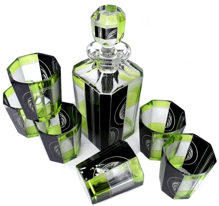 Very high quality, very striking looking 1930's Art Deco Czech glass decanter set. Features a classic shape crystal decanter with stopper and six decent sized glass tumblers . The whole set is enamelled in lime green and black enamel with etching to